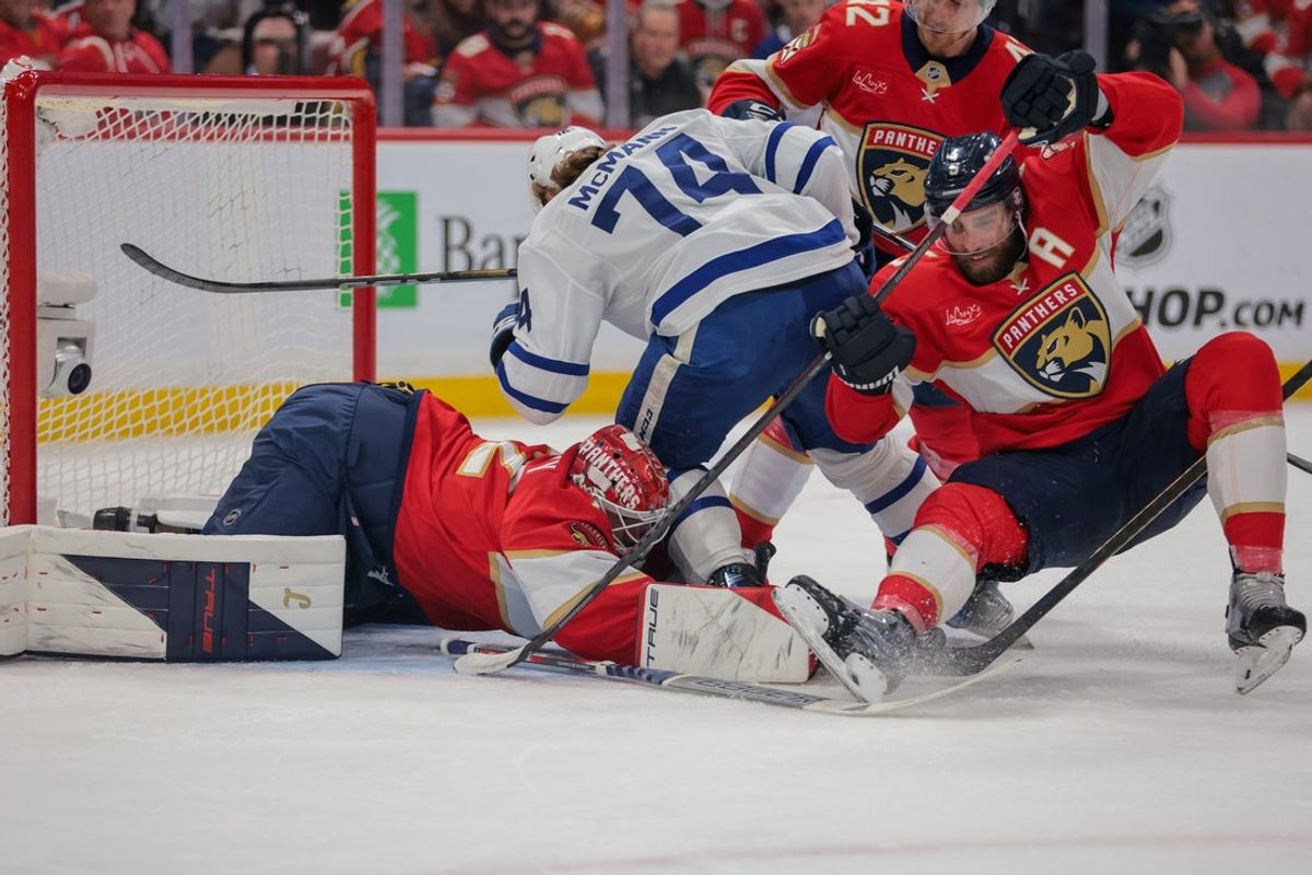May 16, 2025; Sunrise, Florida, USA; Florida Panthers goaltender Sergei Bobrovsky (72) covers the puck from Toronto Maple Leafs center Bobby McMann (74) during the first period in game six of the second round of the 2025 Stanley Cup Playoffs at Amerant Bank Arena. Mandatory Credit: Sam Navarro-Imagn Images