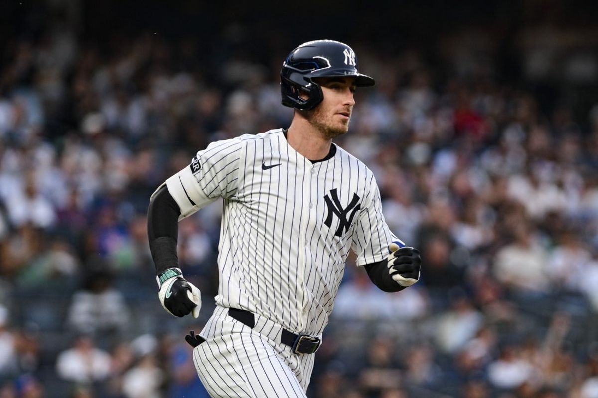 May 16, 2025; Bronx, New York, USA; New York Yankees outfielder Cody Bellinger (35) hits a single against the New York Mets during the first inning at Yankee Stadium. Mandatory Credit: John Jones-Imagn Images