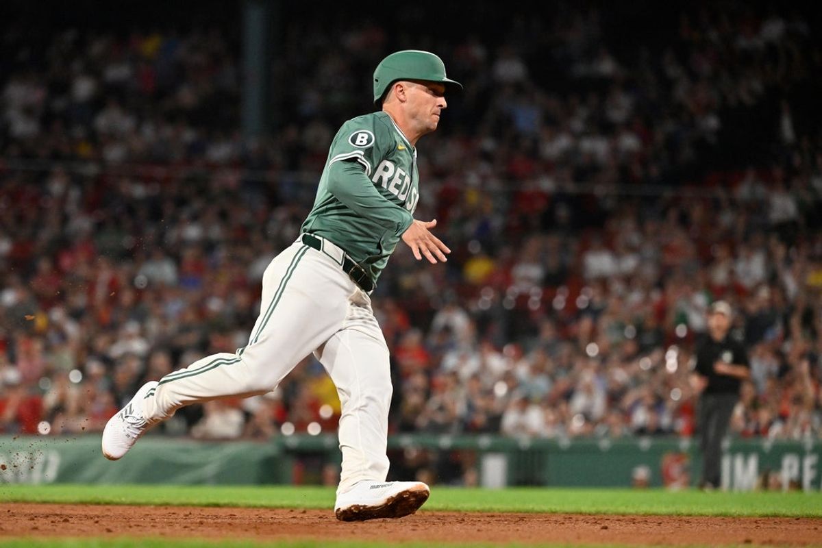 May 16, 2025; Boston, Massachusetts, USA; Boston Red Sox third base Alex Bregman (2) scores on a RBI single by shortstop Trevor Story (not pictured) during the ninth inning against the Atlanta Braves at Fenway Park. Mandatory Credit: Eric Canha-Imagn Images