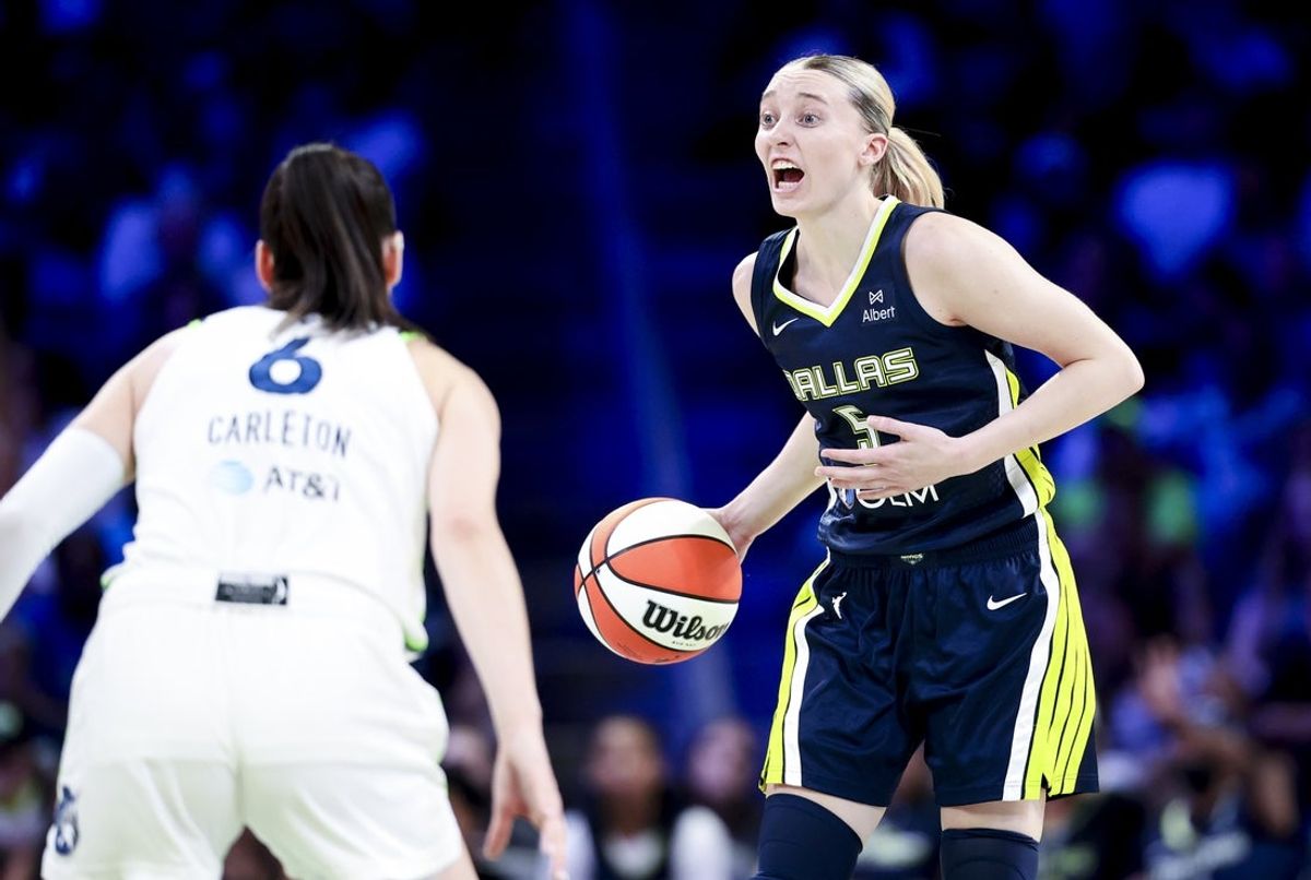 May 16, 2025; Arlington, Texas, USA;  Dallas Wings guard Paige Bueckers (5) yells as Minnesota Lynx forward Bridget Carleton (6) defends during the second half at College Park Center. Mandatory Credit: Kevin Jairaj-Imagn Images