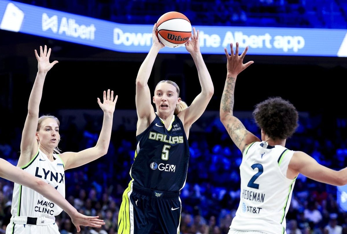 May 16, 2025; Arlington, Texas, USA; Dallas Wings guard Paige Bueckers (5) passes over Minnesota Lynx guard Natisha Hiedeman (2) during the second half at College Park Center. Mandatory Credit: Kevin Jairaj-Imagn Images