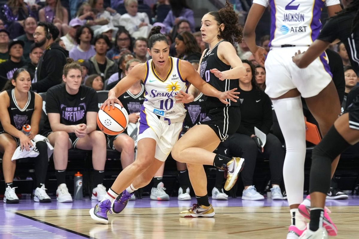 May 16, 2025; San Francisco, California, USA; Los Angeles Sparks guard Kelsey Plum (10) dribbles against Golden State Valkyries guard Carla Leite (center right) during the first quarter at Chase Center. Mandatory Credit: Darren Yamashita-Imagn Images