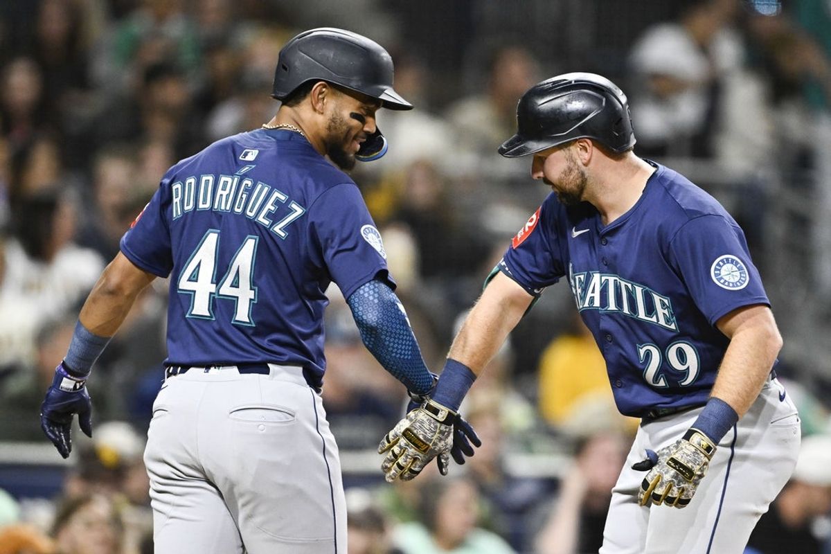May 16, 2025; San Diego, California, USA; Seattle Mariners catcher Cal Raleigh (29) is congratulated by Julio Rodriguez (44) after hitting a two-run home run during sixth inning against the San Diego Padres at Petco Park. Mandatory Credit: Denis Poroy-Imagn Images