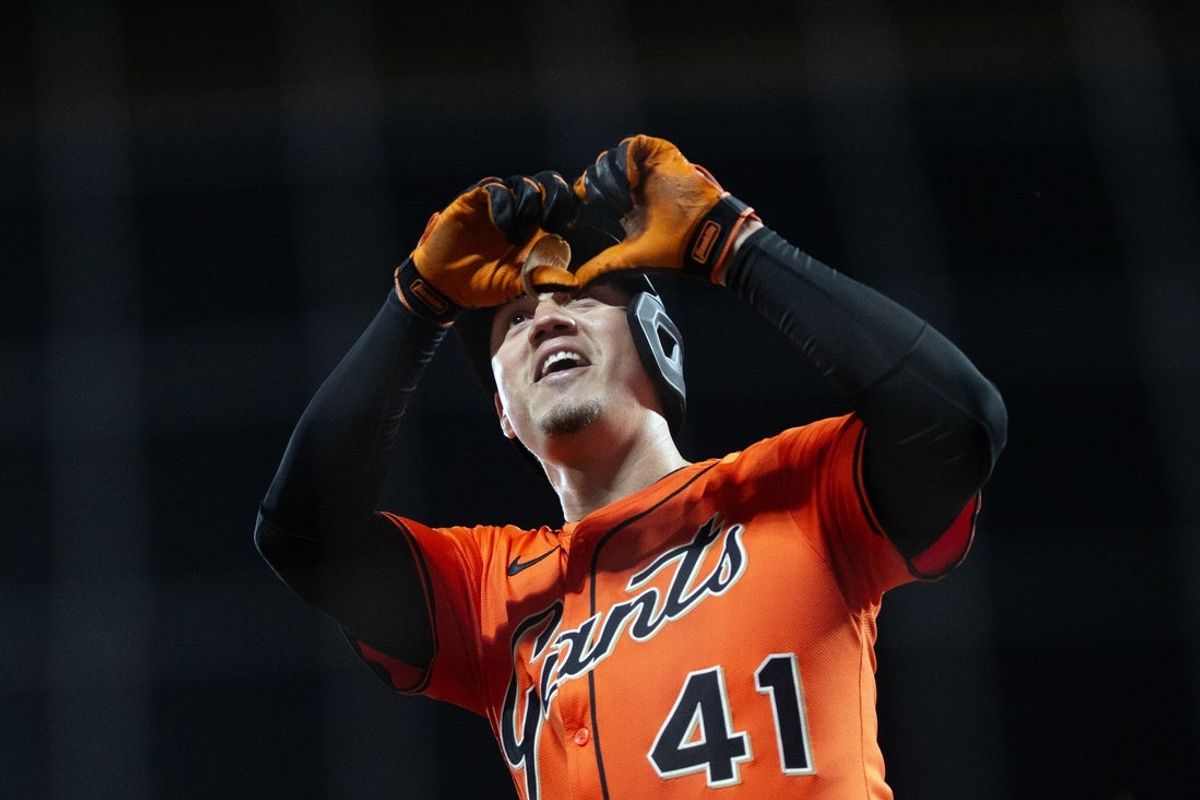 May 16, 2025; San Francisco, California, USA; San Francisco Giants first baseman Wilmer Flores (41) flashes a heart gesture to someone in the stands after running out his third home run of the game against the Athletics during the eighth inning at Oracle Park. Mandatory Credit: D. Ross Cameron-Imagn Images