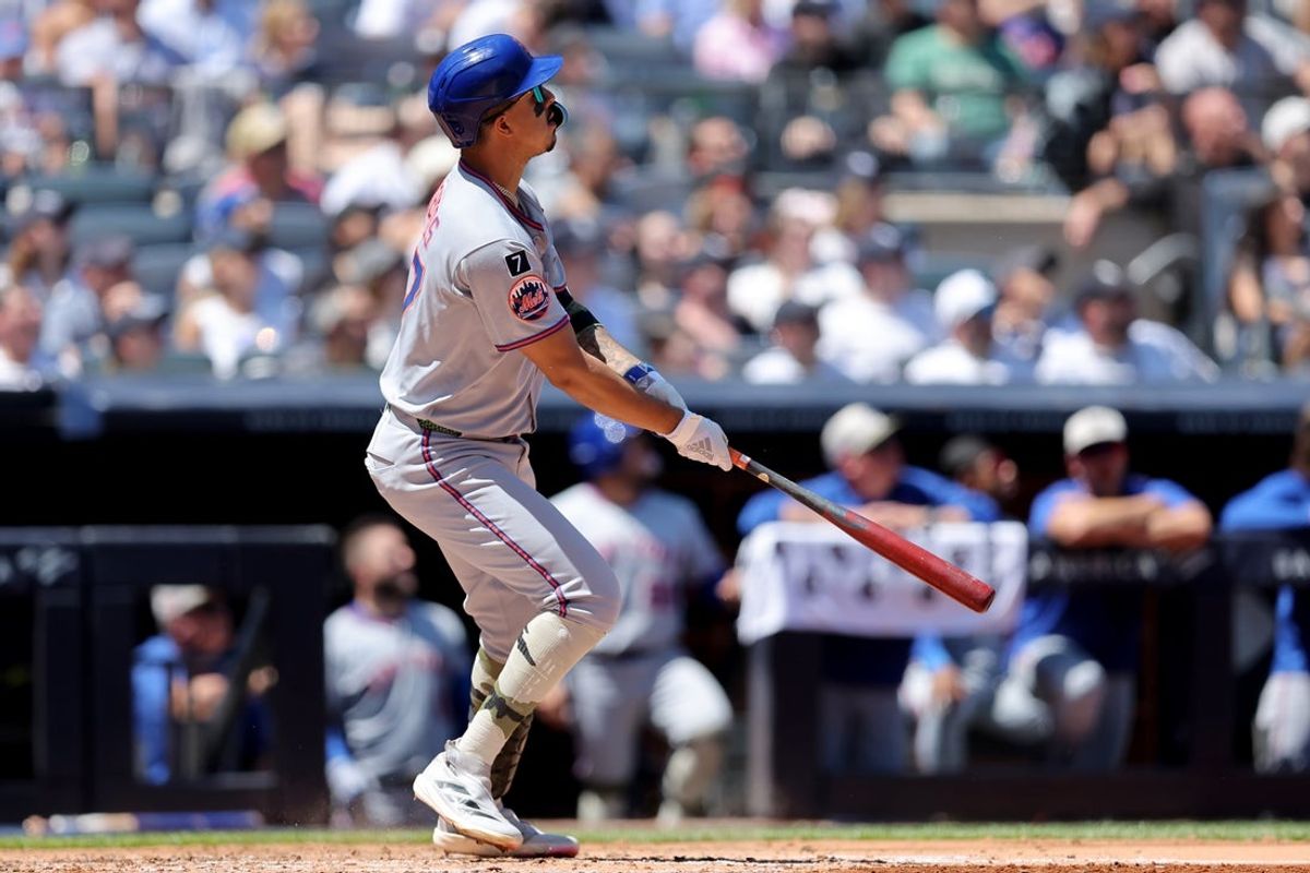 May 17, 2025; Bronx, New York, USA; New York Mets designated hitter Mark Vientos (27) watches his RBI sacrifice fly against the New York Yankees during the fourth inning at Yankee Stadium. Mandatory Credit: Brad Penner-Imagn Images