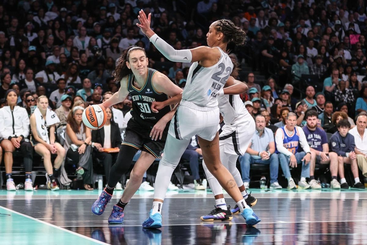 May 17, 2025; Brooklyn, New York, USA;  New York Liberty forward Breanna Stewart (30) looks to drive past Las Vegas Aces center A'ja Wilson (22) in the fourth quarter at Barclays Center. Mandatory Credit: Wendell Cruz-Imagn Images