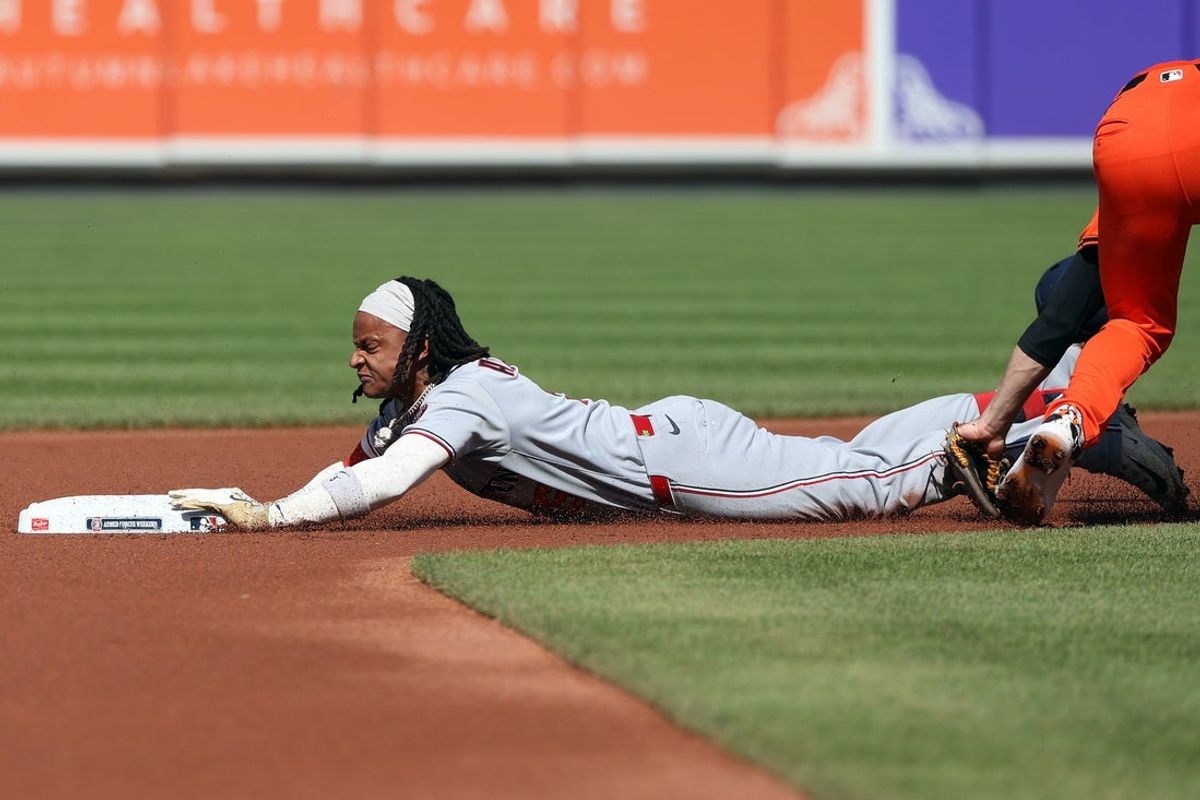 May 17, 2025; Baltimore, Maryland, USA; Washington Nationals shortstop CJ Abrams (5) slides into second after hitting a double during the first inning against the Baltimore Orioles at Oriole Park at Camden Yards. Mandatory Credit: Daniel Kucin Jr.-Imagn Images