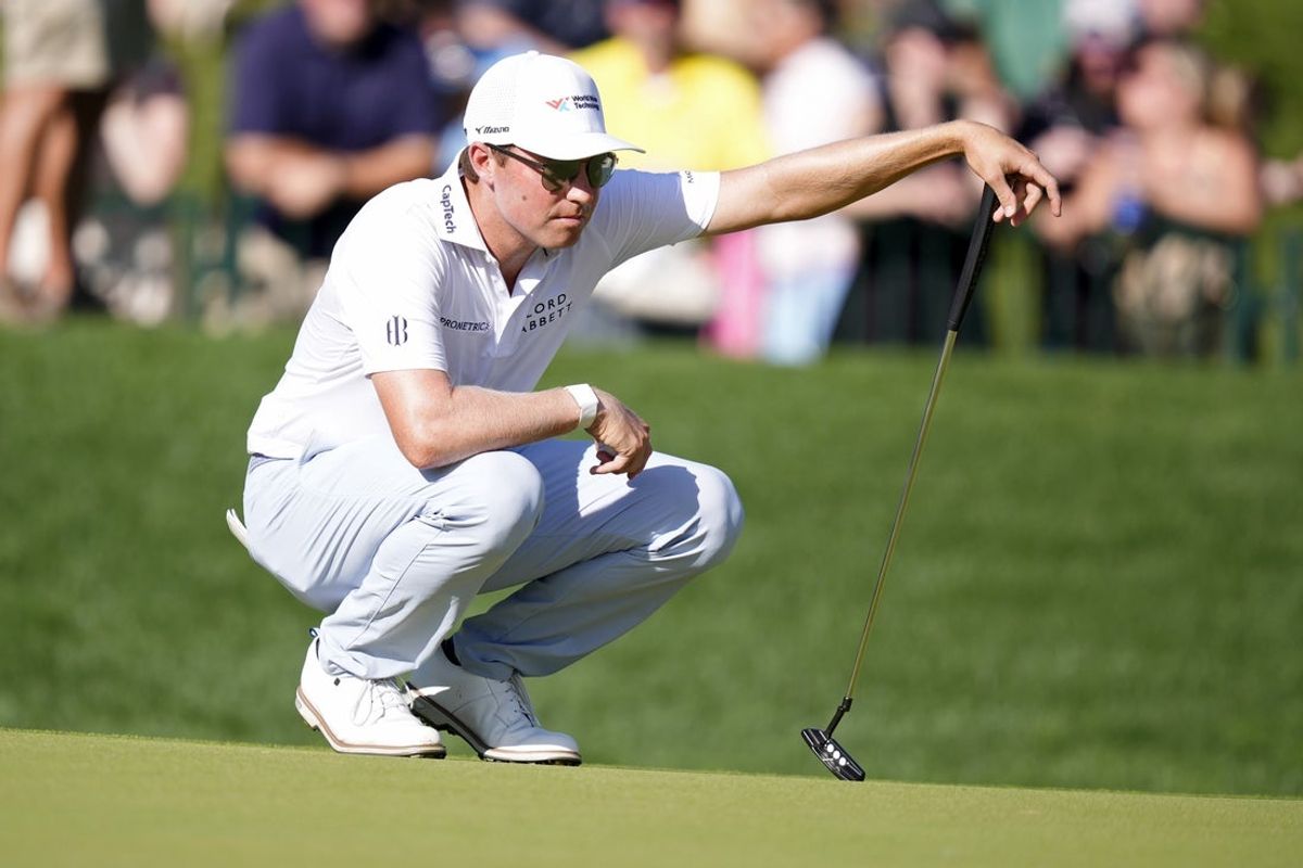 May 17, 2025; Charlotte, North Carolina, USA; Ben Griffin lines up a putt on the 18th green during the third round of the PGA Championship golf tournament at Quail Hollow. Mandatory Credit: Jim Dedmon-Imagn Images