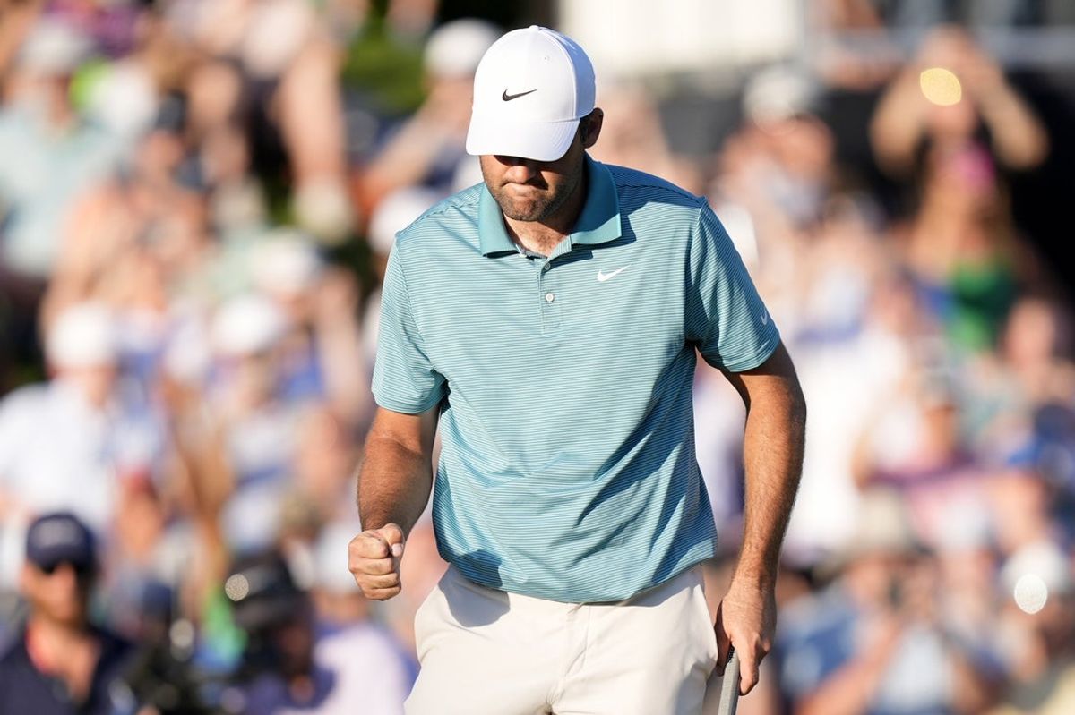 May 17, 2025; Charlotte, North Carolina, USA; Scottie Scheffler reacts after a putt on the 18th green during the third round of the PGA Championship golf tournament at Quail Hollow. Mandatory Credit: Jim Dedmon-Imagn Images