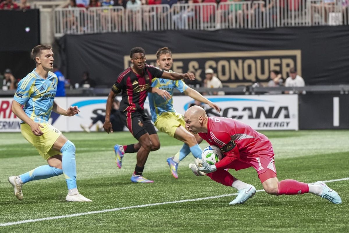May 17, 2025; Atlanta, Georgia, USA; Atlanta United goalkeeper Brad Guzan (1) makes a save against the Philadelphia Union during the first half at Mercedes-Benz Stadium. Mandatory Credit: Dale Zanine-Imagn Images