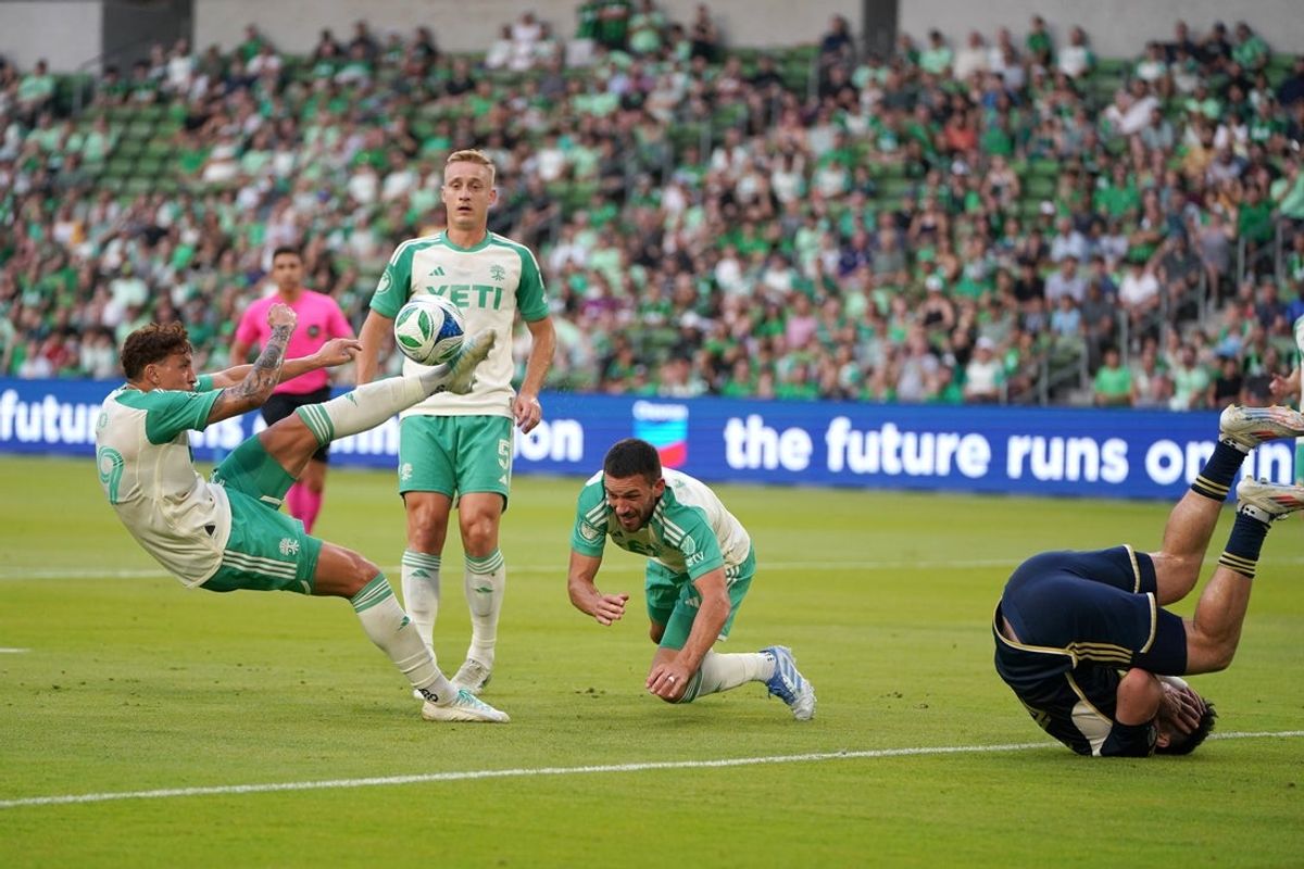 May 17, 2025; Austin, Texas, USA; Austin FC defender Guilherme Biro (29) kicks against Vancouver Whitecaps FC during the first half at Q2 Stadium. Mandatory Credit: Dustin Safranek-Imagn Images
