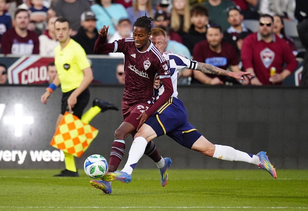 May 17, 2025; Commerce City, Colorado, USA; Real Salt Lake defender Justen Glad (15) defends on Colorado Rapids forward Rafael Navarro (9) in the first half at Dick's Sporting Goods Park. Mandatory Credit: Ron Chenoy-Imagn Images