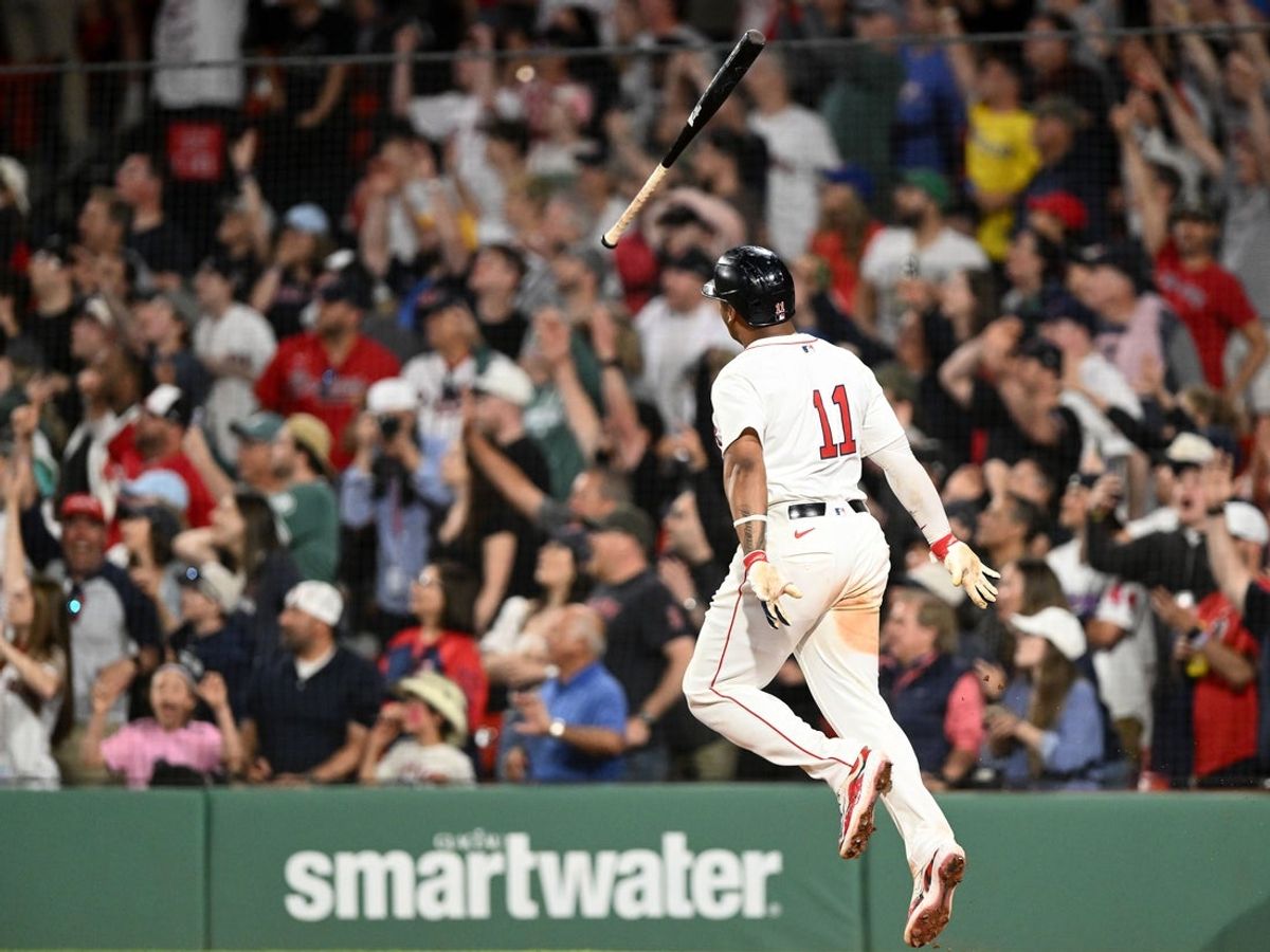 May 17, 2025; Boston, Massachusetts, USA; Boston Red Sox designated hitter Rafael Devers (11) hits a walk off home run against the Atlanta Braves during the ninth inning at Fenway Park. Mandatory Credit: Brian Fluharty-Imagn Images
