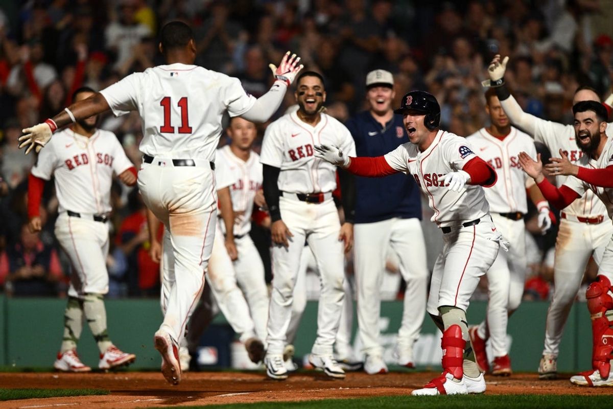 May 17, 2025; Boston, Massachusetts, USA; Boston Red Sox designated hitter Rafael Devers (11) celebrates with third baseman Alex Bregman (2) after hitting a walk off home run against the Atlanta Braves during the ninth inning at Fenway Park. Mandatory Credit: Brian Fluharty-Imagn Images
