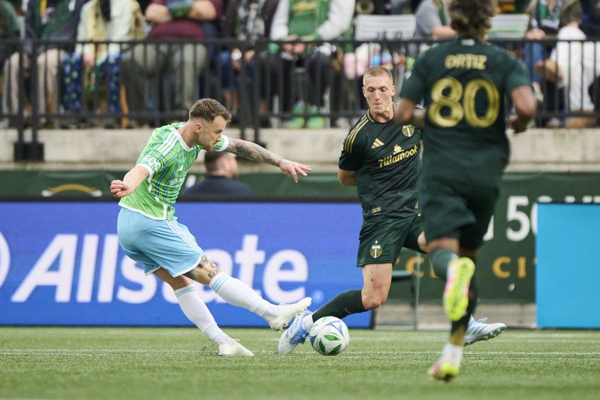 May 17, 2025; Portland, Oregon, USA; Seattle Sounders midfielder Albert Rusnak (11) scores a goal during the first half against Portland Timbers defender Finn Surman (20) at Providence Park. Mandatory Credit: Troy Wayrynen-Imagn Images