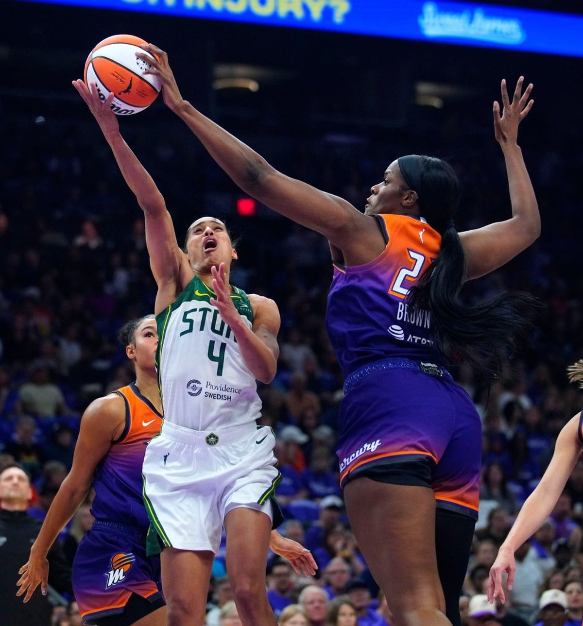 Mercury center Kalani Brown (21) blocks a layup from Storm guard Skylar Diggins (4) during the Mercury home opener in the PHX Arena in Phoenix, on May 17, 2025.