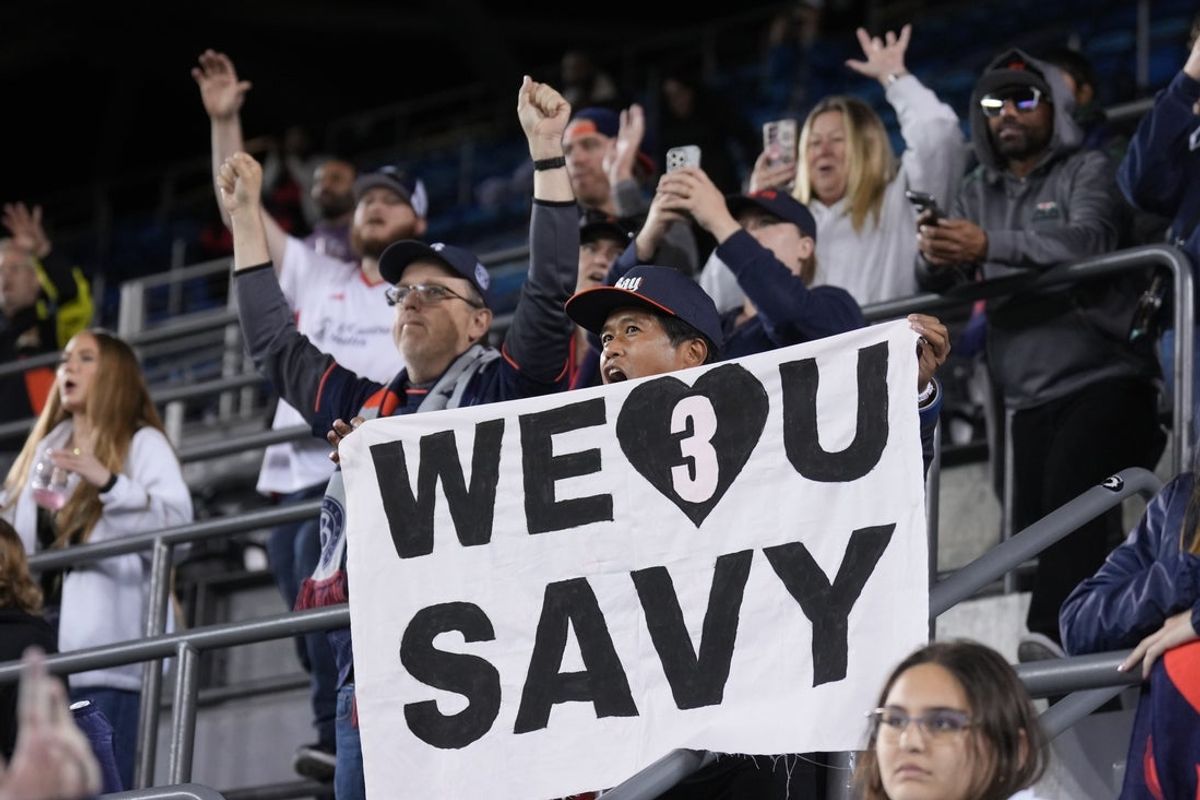 May 17, 2025; San Jose, California, USA; A fan of Bay FC holds up a sign in support of Angel City FC defender Savy King (3) after the game at PayPal Park. Mandatory Credit: Darren Yamashita-Imagn Images
