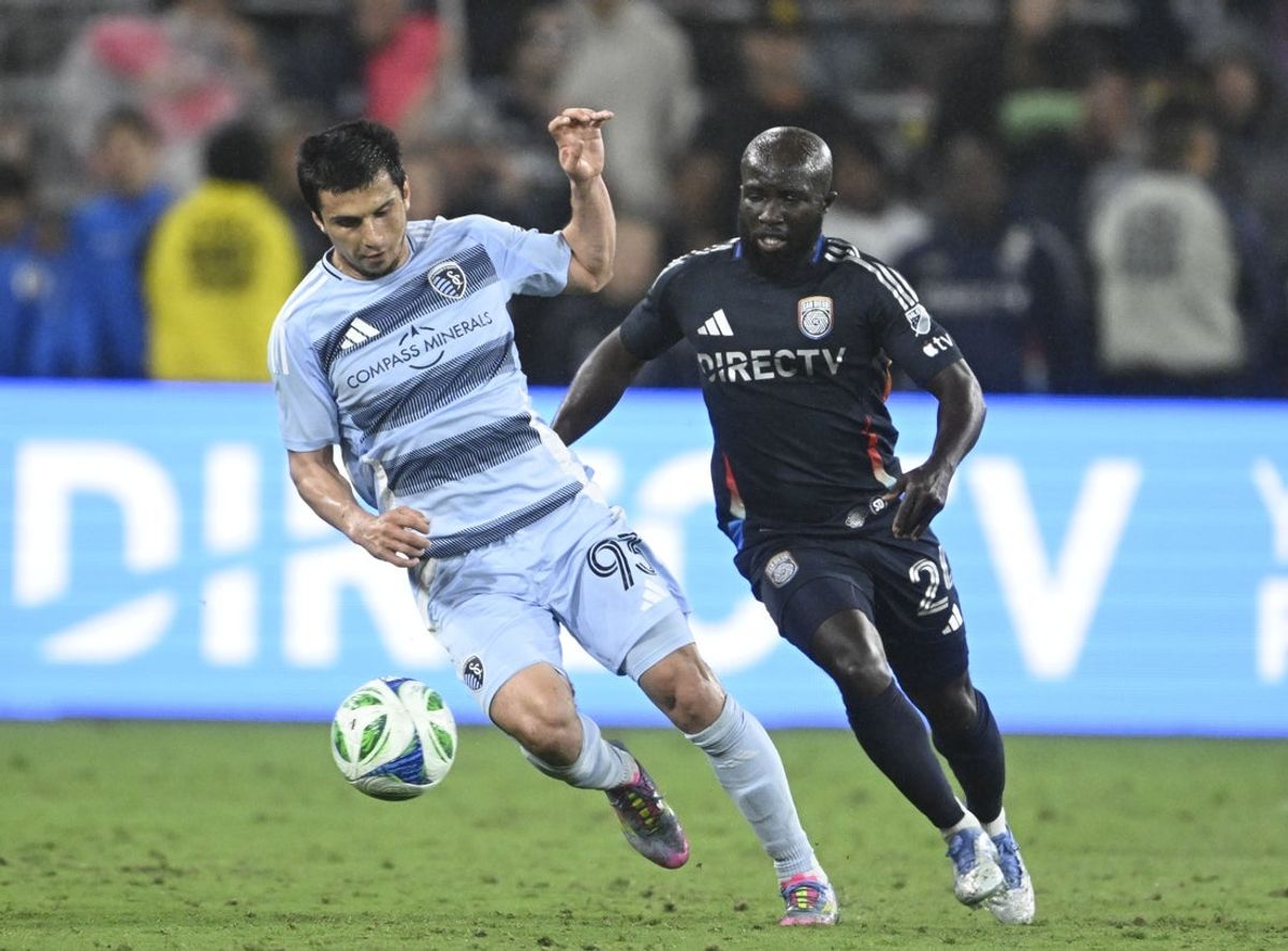 May 17, 2025; San Diego, California, USA; Sporting Kansas City forward Magomed Suleymanov (93) fight for the ball with San Diego FC midfielder Ema Boateng (24) during the second half at Snapdragon Stadium. Mandatory Credit: Denis Poroy-Imagn Images