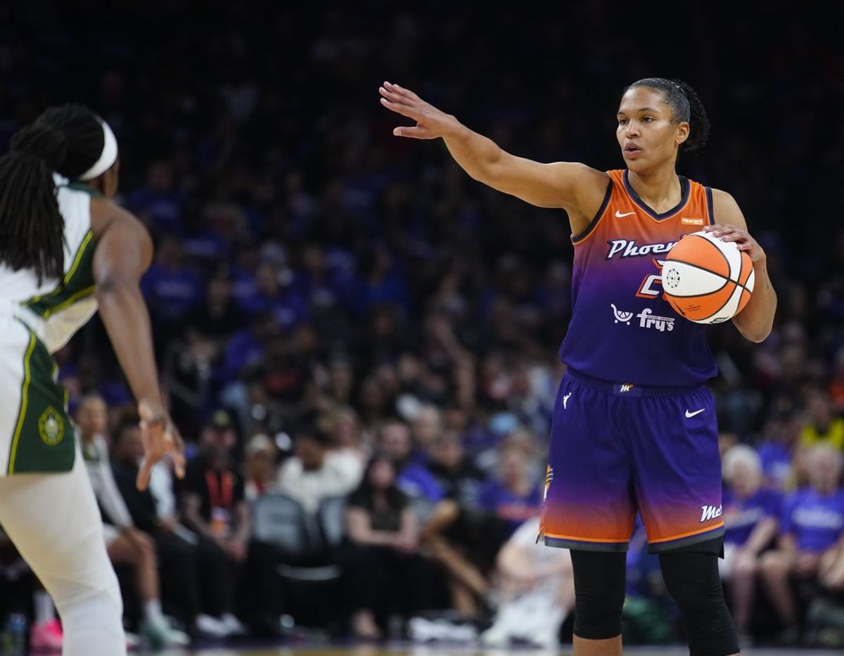 Phoenix Mercury forward Alyssa Thomas (25) calls out to her team while dribbling against the Seattle Storm during the Mercury home opener in the PHX Arena in Phoenix on May 17, 2025.