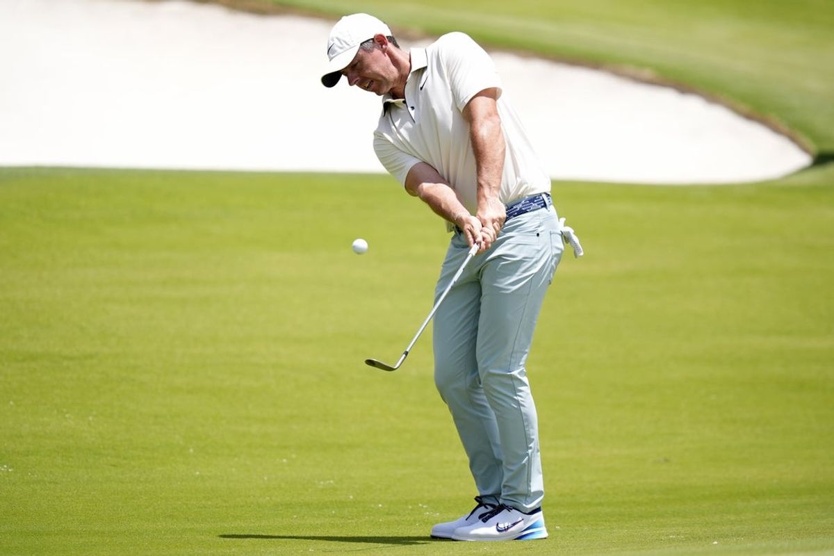 May 18, 2025; Charlotte, North Carolina, USA; Rory McIlroy takes a shot on the 15th hole during the final round of the PGA Championship golf tournament at Quail Hollow. Mandatory Credit: Jim Dedmon-Imagn Images