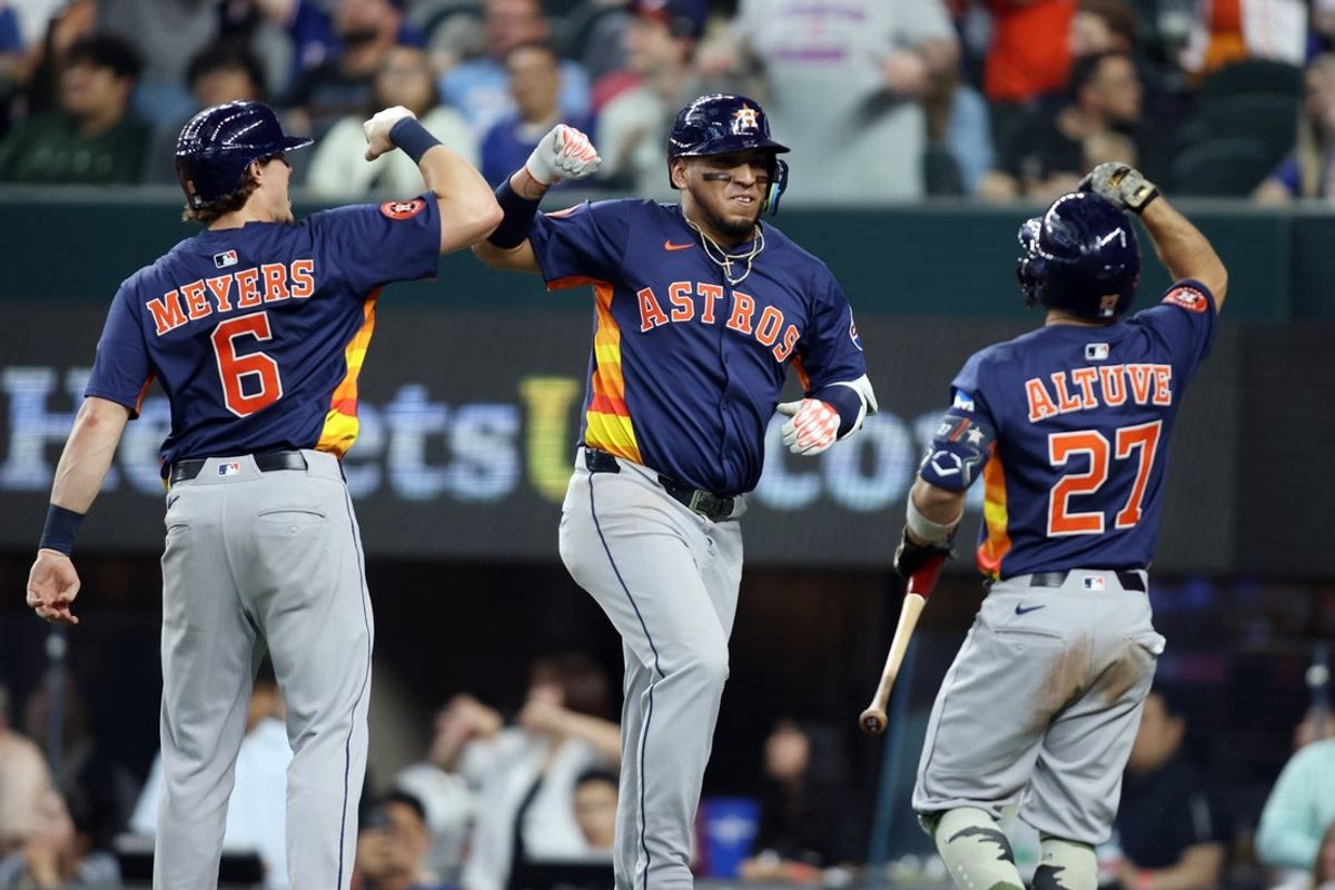 May 18, 2025; Arlington, Texas, USA; Houston Astros third base Isaac Paredes (15) is congratulated by outfielder Jake Meyers (6) and designated hitter Jose Altuve (27) after hitting a three run home run during the eighth inning against the Texas Rangers at Globe Life Field. Mandatory Credit: Tim Heitman-Imagn Images