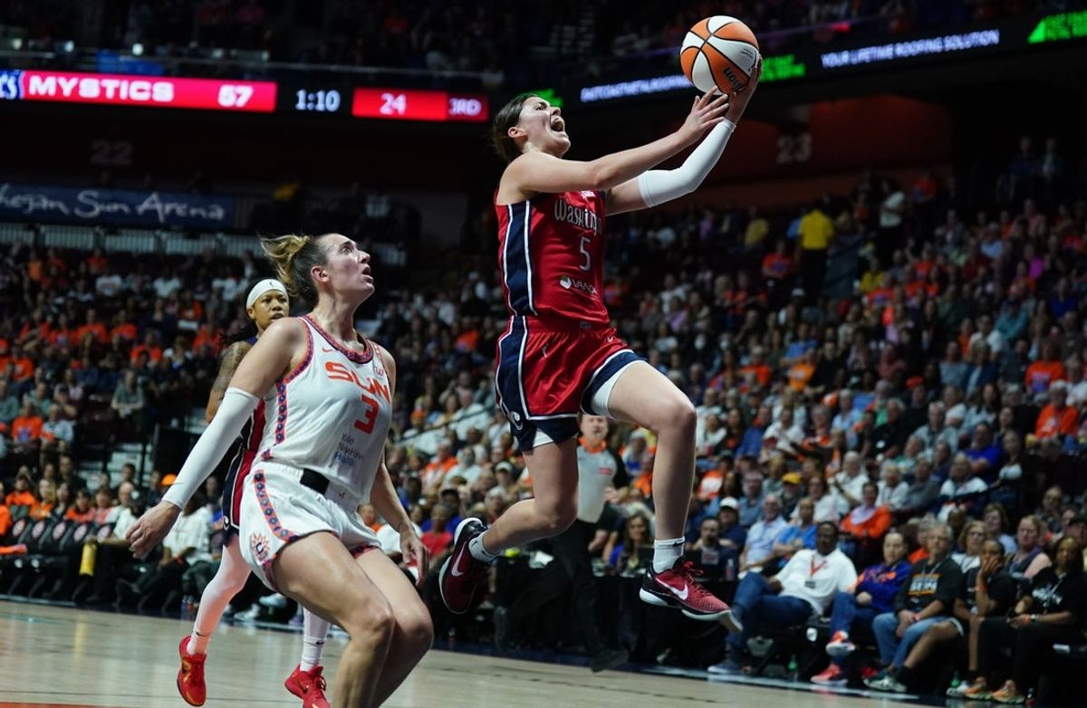May 18, 2025; Uncasville, Connecticut, USA; Washington Mystics guard Jade Melbourne (5) drives to the basket against Connecticut Sun guard Marina Mabrey (3) in the second half at Mohegan Sun Arena. Mandatory Credit: David Butler II-Imagn Images