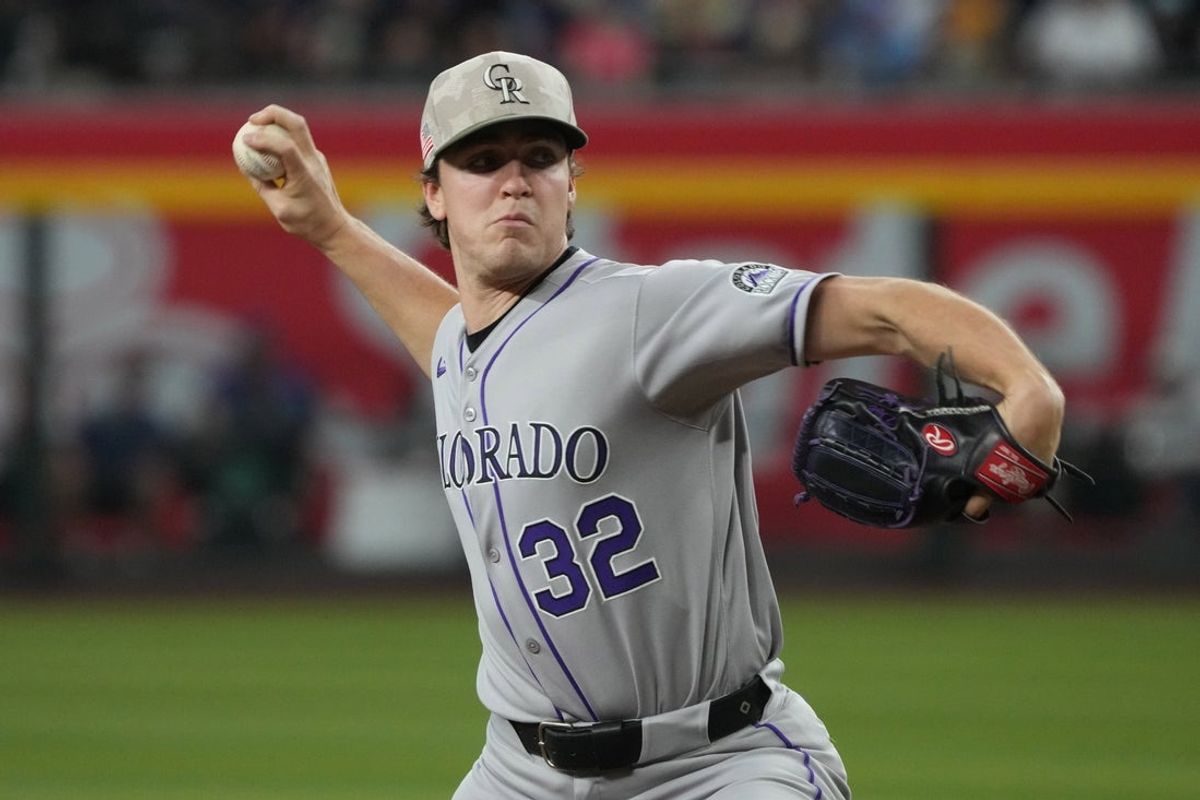 May 18, 2025; Phoenix, Arizona, USA; Colorado Rockies pitcher Chase Dollander (32) throws against the Arizona Diamondbacks in the first inning at Chase Field. Mandatory Credit: Rick Scuteri-Imagn Images