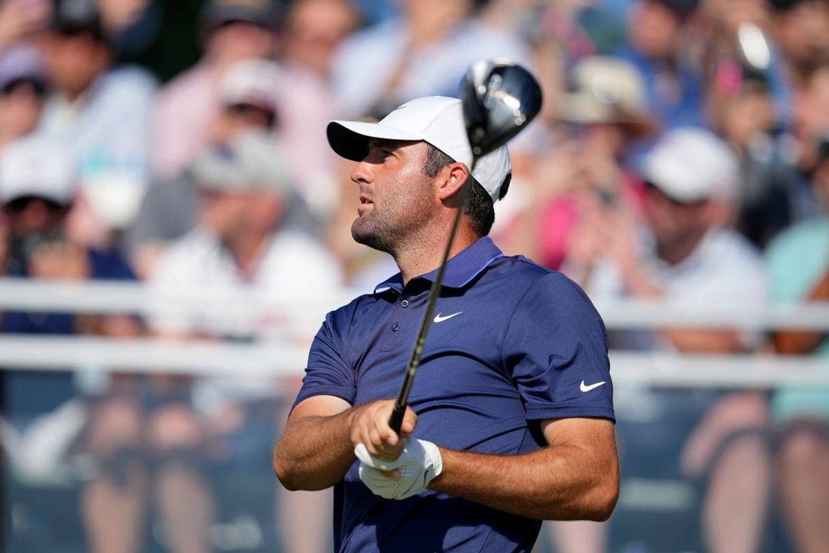 May 18, 2025; Charlotte, North Carolina, USA; Scottie Scheffler tees off on the 15th hole during the final round of the PGA Championship golf tournament at Quail Hollow. Mandatory Credit: Aaron Doster-Imagn Images