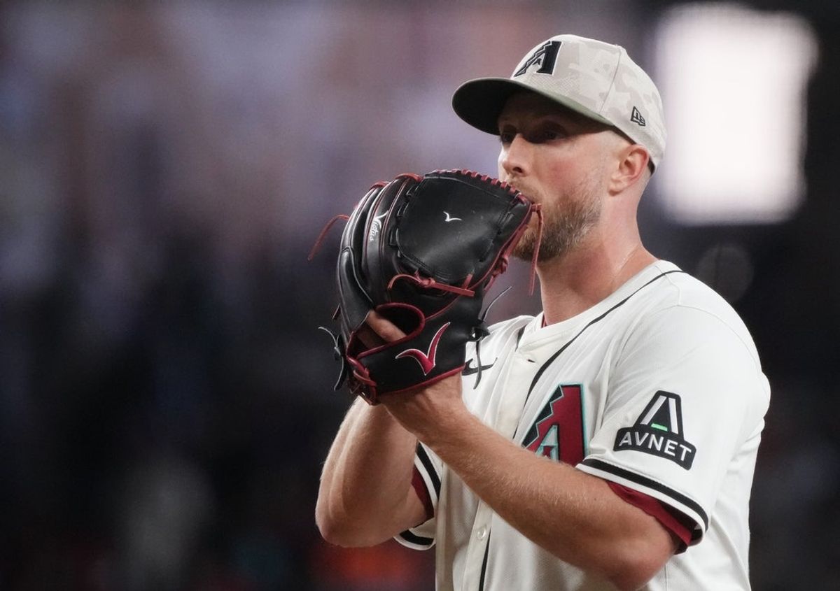 May 18, 2025; Phoenix, Ariz., U.S.; Arizona Diamondbacks Merrill Kelly (29) pitches against the Colorado Rockies at Chase Field in Phoenix on May 18, 2025.