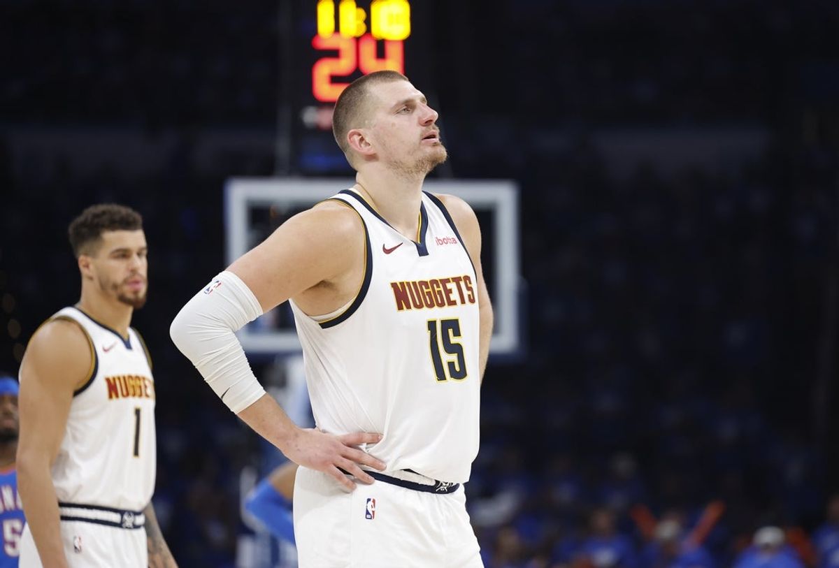 May 18, 2025; Oklahoma City, Oklahoma, USA; Denver Nuggets center Nikola Jokic (15) watches Oklahoma City Thunder guard Shai Gilgeous-Alexander shoot free throws in the second half of game seven of the second round for the 2025 NBA Playoffs at Paycom Center. Mandatory Credit: Alonzo Adams-Imagn Images