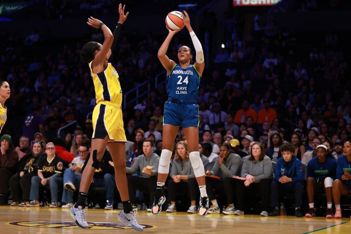 May 18, 2025; Los Angeles, California, USA;  Minnesota Lynx forward Napheesa Collier (24) shoots the ball over Los Angeles Sparks forward Azura Stevens (23) during the first quarter at Crypto.com Arena. Mandatory Credit: Kiyoshi Mio-Imagn Images