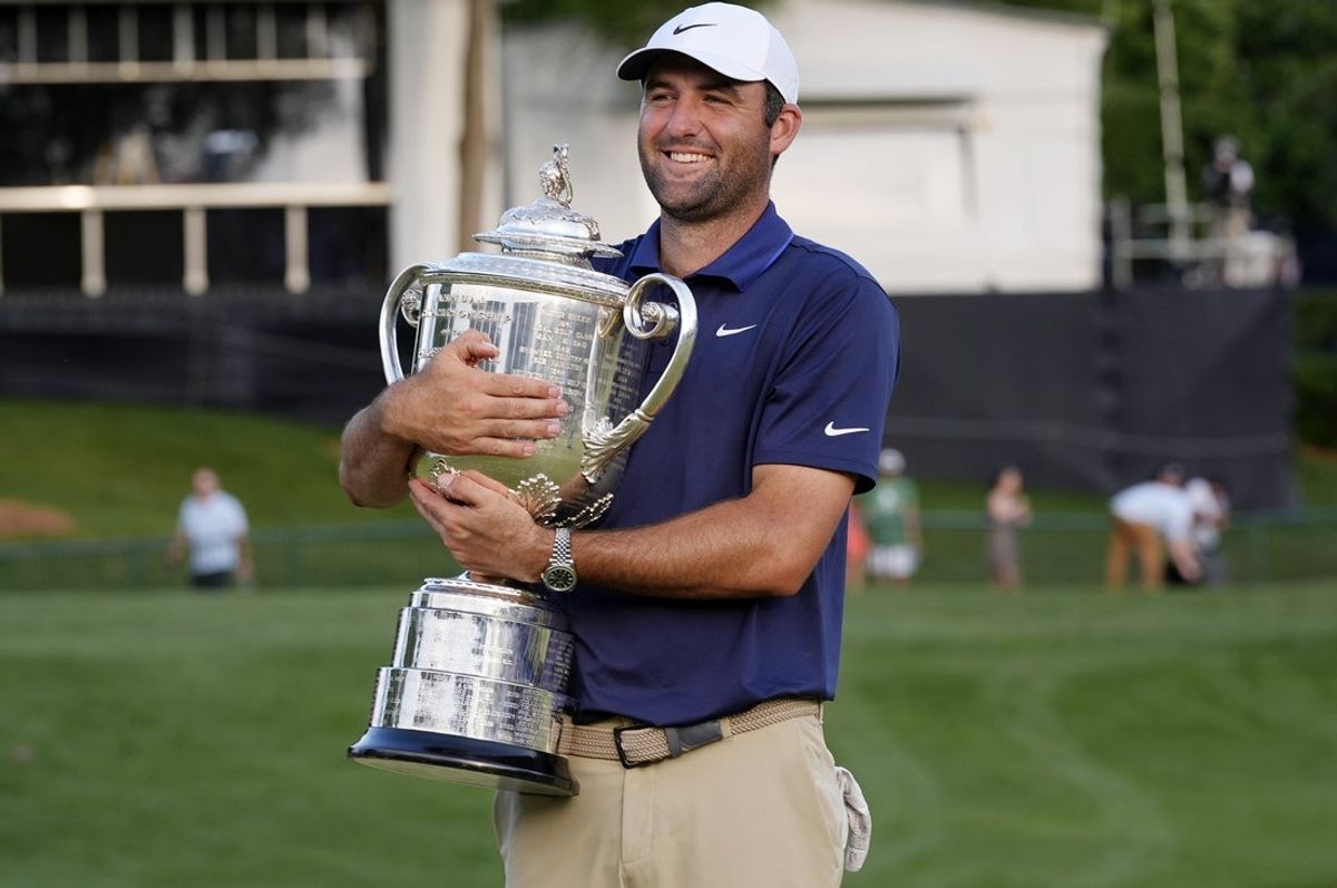 May 18, 2025; Charlotte, North Carolina, USA; Scottie Scheffler holds the Wanamaker Trophy after winning the PGA Championship golf tournament at Quail Hollow. Mandatory Credit: Jim Dedmon-Imagn Images