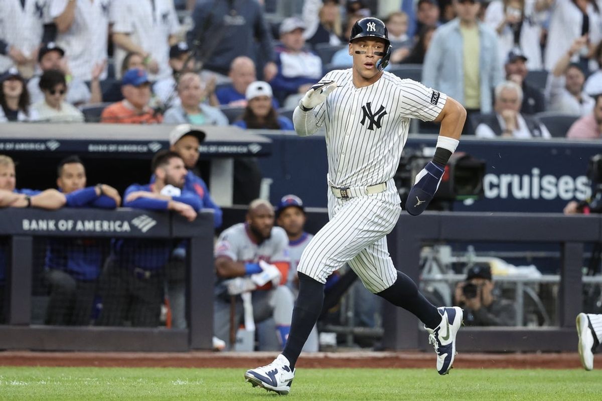 May 18, 2025; Bronx, New York, USA;  New York Yankees right fielder Aaron Judge (99) runs to home plate in the first inning against the New York Mets at Yankee Stadium. Mandatory Credit: Wendell Cruz-Imagn Images