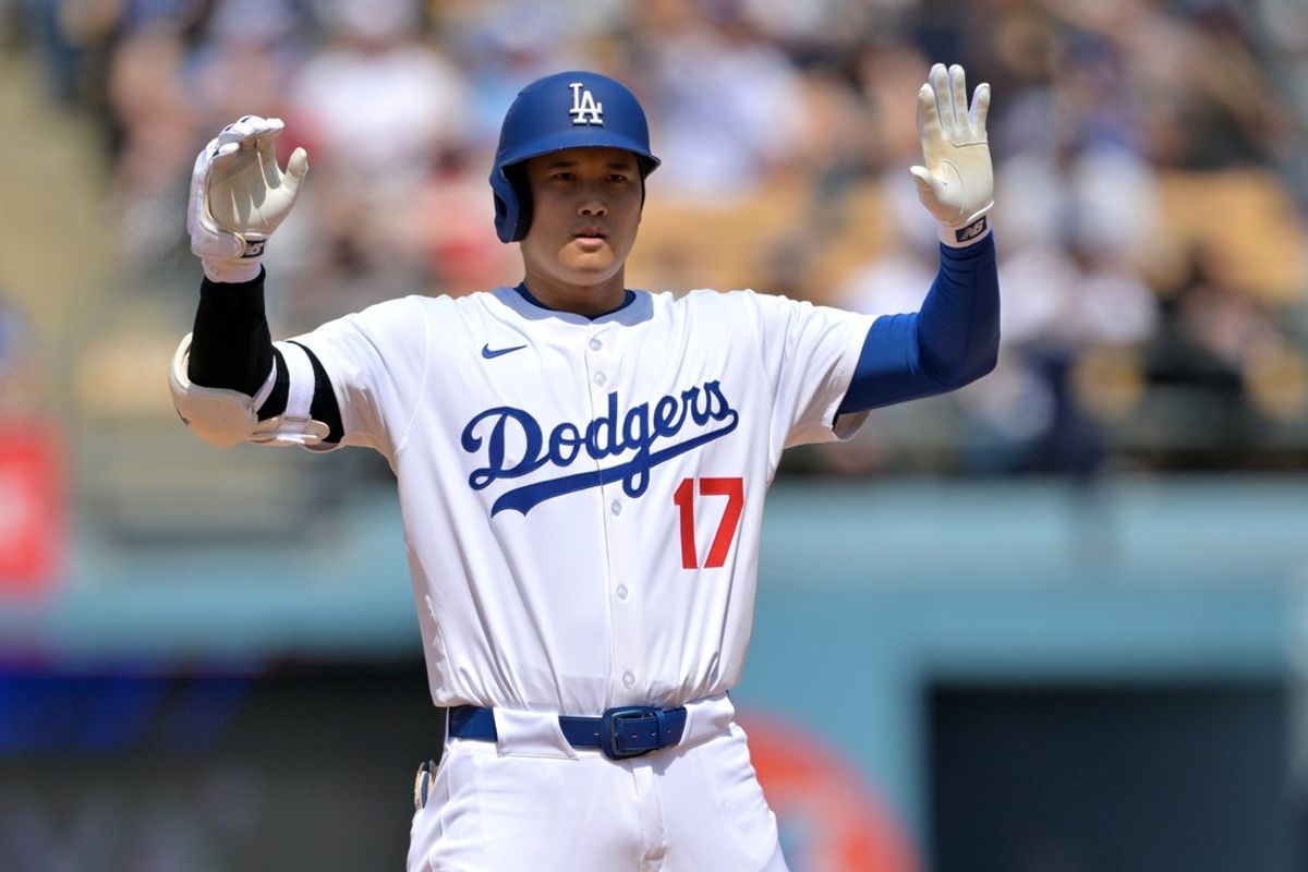 May 18, 2025; Los Angeles, California, USA;  Los Angeles Dodgers designated hitter Shohei Ohtani (17) waves to the dugout after he advanced to second on a fielders choice in the fifth inning against the Los Angeles Angels at Dodger Stadium. Mandatory Credit: Jayne Kamin-Oncea-Imagn Images