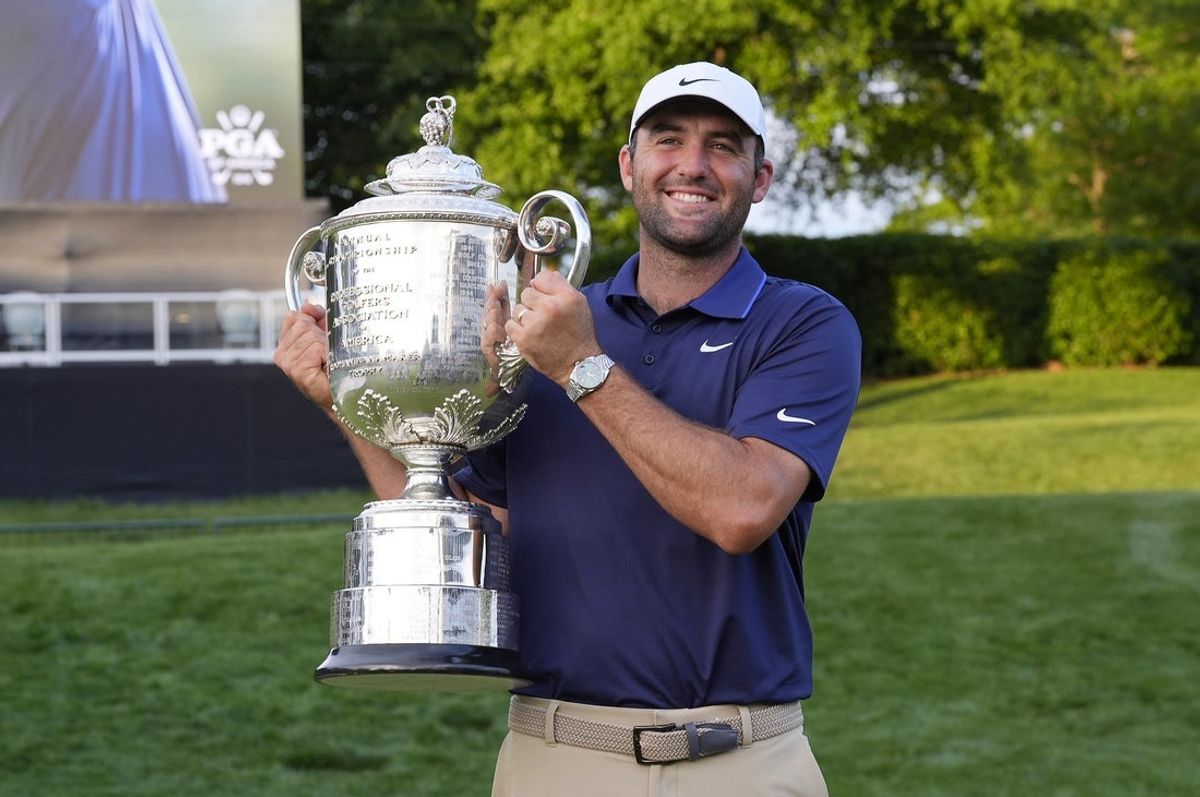 May 18, 2025; Charlotte, North Carolina, USA; Scottie Scheffler poses for a photo with the Wanamaker Trophy after winning the PGA Championship golf tournament at Quail Hollow. Mandatory Credit: Jim Dedmon-Imagn Images