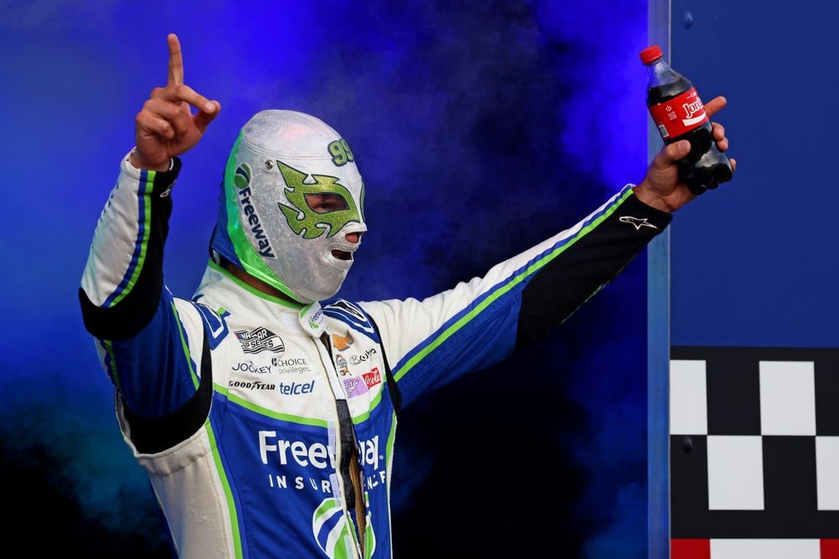 May 18, 2025; North Wilkesboro, North Carolina, USA; NASCAR Cup Series driver Daniel Suarez (99) is introduced before the NASCAR All-Star Open at North Wilkesboro Speedway. Mandatory Credit: Peter Casey-Imagn Images