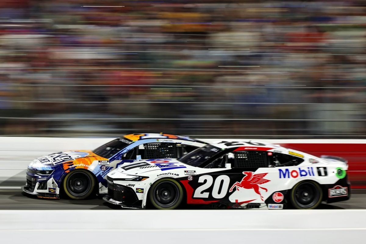 May 18, 2025; North Wilkesboro, North Carolina, USA; NASCAR Cup Series driver Christopher Bell (20) and NASCAR Cup Series driver Ross Chastain (1) during NASCAR All-Star Race at North Wilkesboro Speedway. Mandatory Credit: Peter Casey-Imagn Images