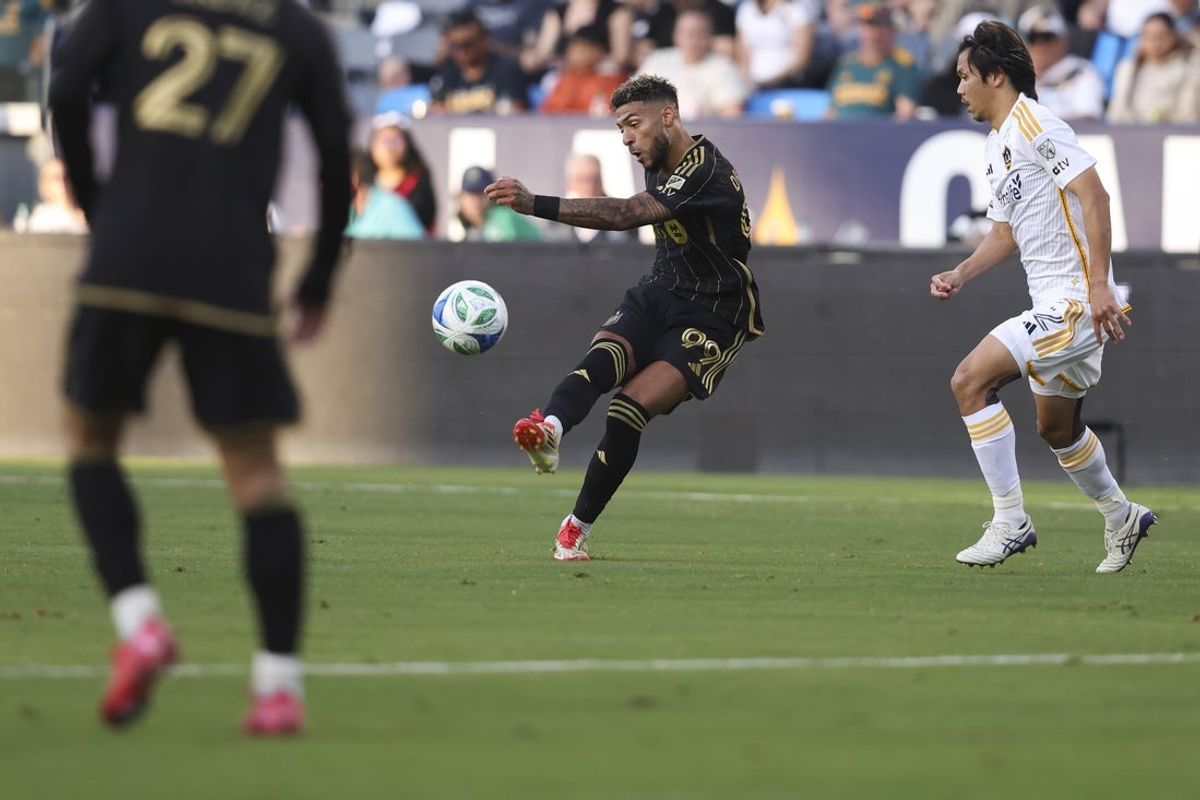 May 18, 2025; Carson, California, USA; Los Angeles FC forward Denis Bouanga (99) shoots the ball during the first half of a soccer game against the Los Angeles Galaxy at Dignity Health Sports Park. Mandatory Credit: Jessica Alcheh-Imagn Images