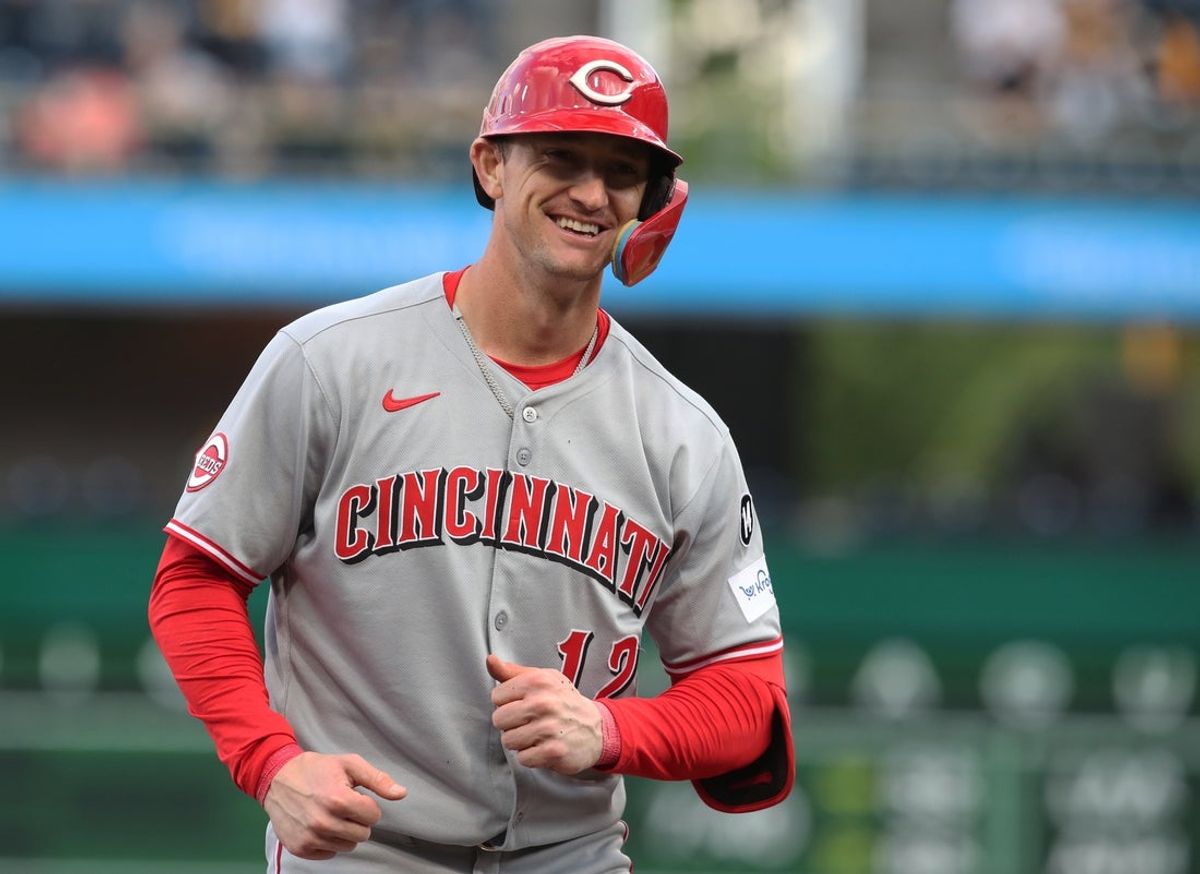 May 19, 2025; Pittsburgh, Pennsylvania, USA;  Cincinnati Reds left fielder Austin Hays (12) reacts after hitting an RBI double against the Pittsburgh Pirates during the first inning at PNC Park. Mandatory Credit: Charles LeClaire-Imagn Images