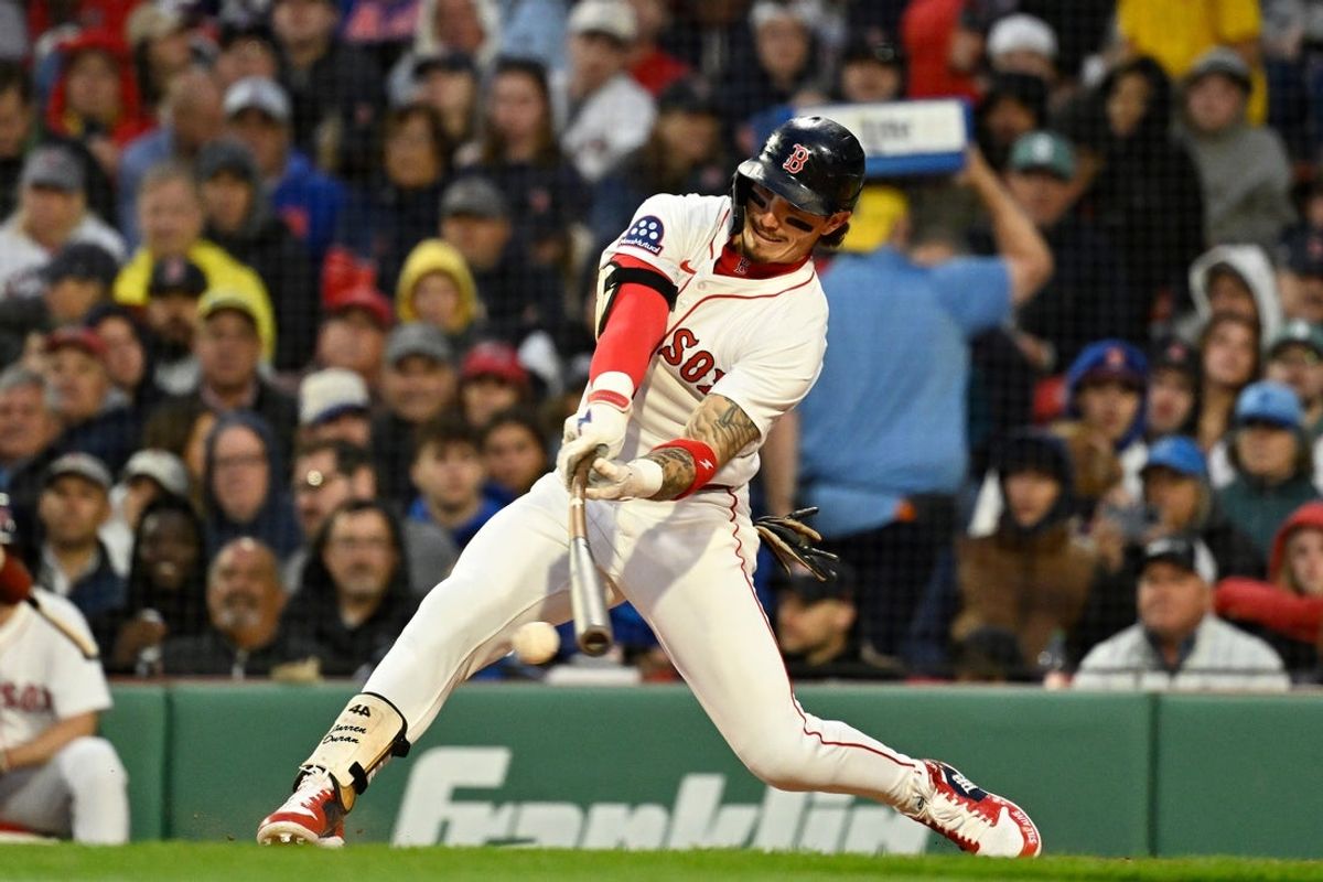 May 19, 2025; Boston, Massachusetts, USA; Boston Red Sox outfielder Jarren Duran (16) hits a double against the New York Mets  during the fourth inning at Fenway Park. Mandatory Credit: Eric Canha-Imagn Images