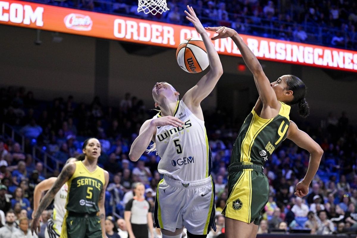 May 19, 2025; Arlington, Texas, USA;  Seattle Storm guard Skylar Diggins (4) blocks a shot by Dallas Wings guard Paige Bueckers (5) during the first half at College Park Center. Mandatory Credit: Jerome Miron-Imagn Images