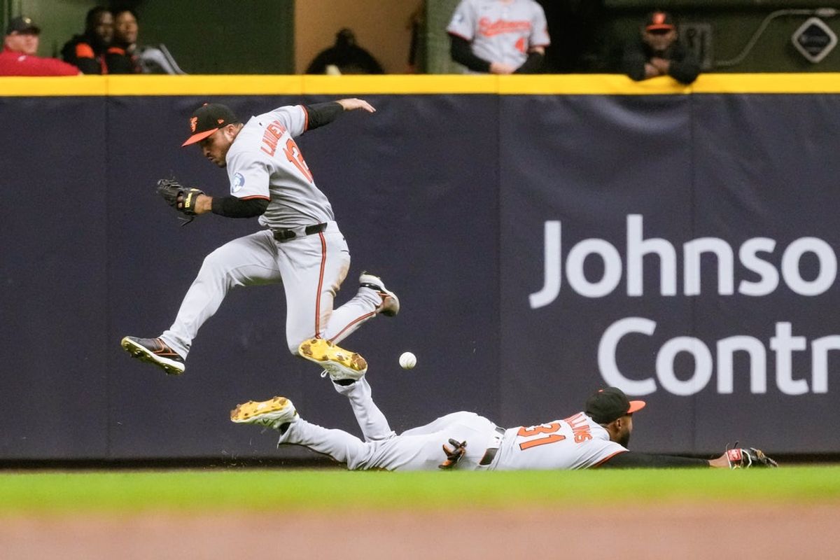 May 19, 2025; Milwaukee, Wisconsin, USA;  Baltimore Orioles center fielder Cedric Mullins (31) tries to make a diving catch on the fly ball hit by Milwaukee Brewers second baseman Brice Turang (2) (not pictured) during the fifth inning at American Family Field. Mandatory Credit: Jeff Hanisch-Imagn Images