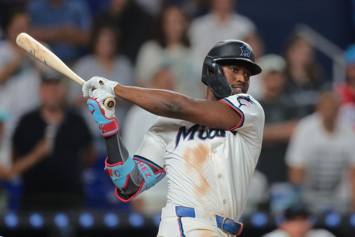 May 19, 2025; Miami, Florida, USA; Miami Marlins right fielder Jesus Sanchez (7) hits a two-run walk-off triple against the Chicago Cubs during the ninth inning at loanDepot Park. Mandatory Credit: Sam Navarro-Imagn Images