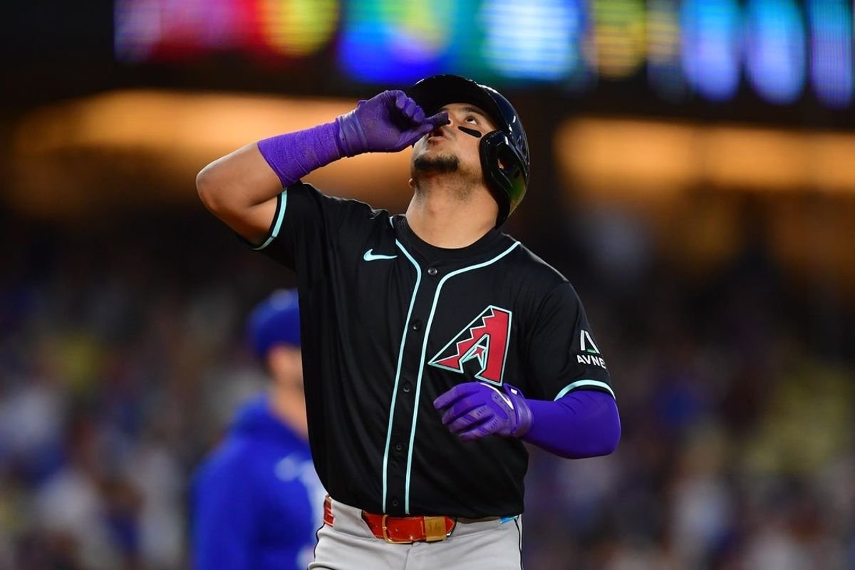 May 19, 2025; Los Angeles, California, USA;  Arizona Diamondbacks catcher Gabriel Moreno (14) celebrates after hitting a two run home run in the third inning against the Los Angeles Dodgers at Dodger Stadium. Mandatory Credit: Gary A. Vasquez-Imagn Images