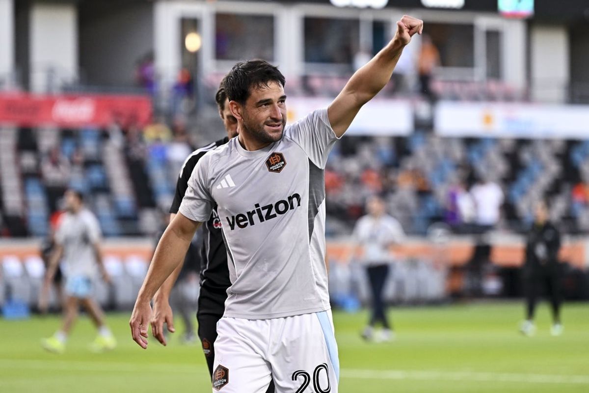 May 14, 2025; Houston, Texas, USA; Houston Dynamo FC midfielder Nicolas Lodeiro (20) waves to fans prior to the match against the Minnesota United FC at Shell Energy Stadium. Mandatory Credit: Maria Lysaker-Imagn Images
