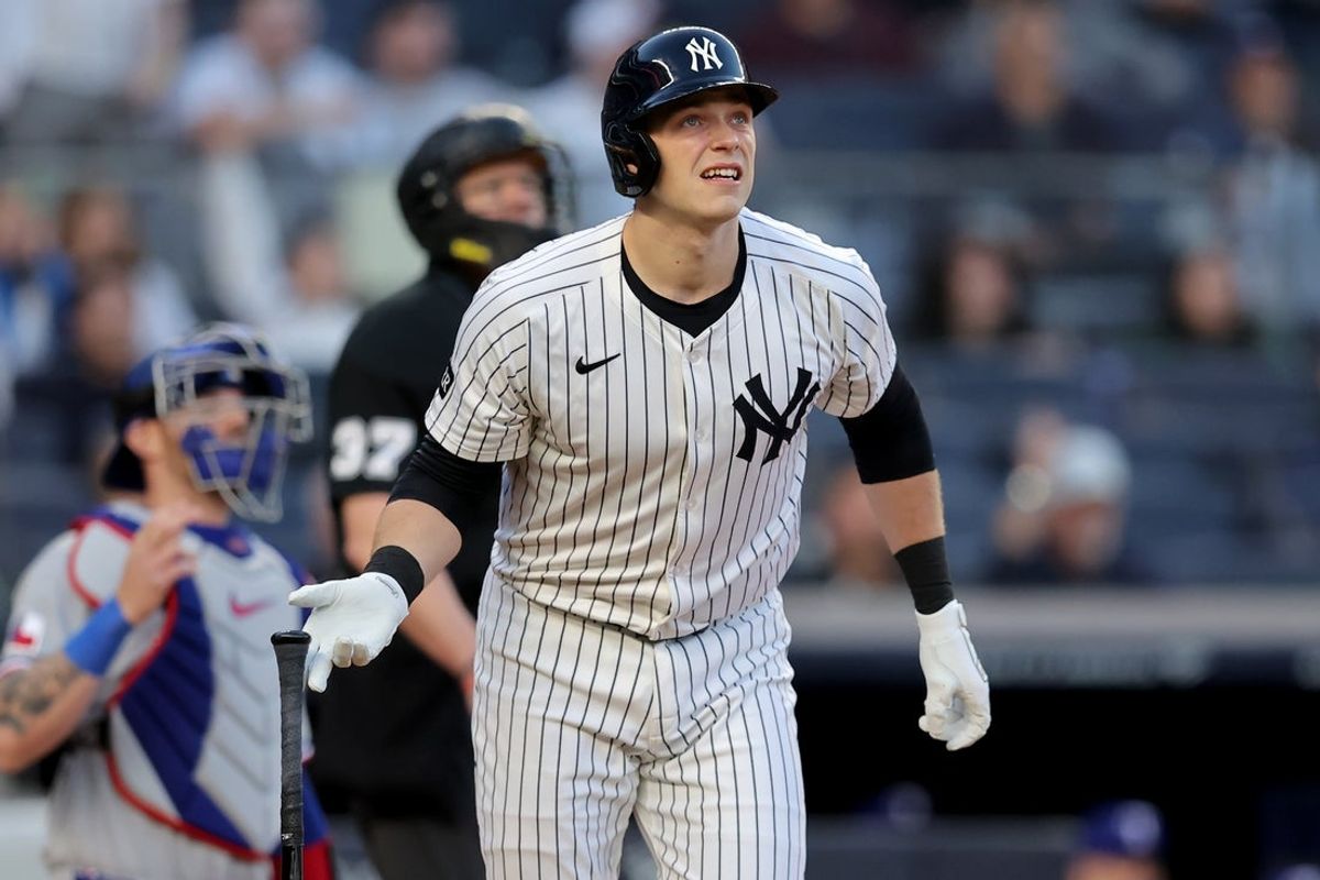 May 20, 2025; Bronx, New York, USA; New York Yankees designated hitter Ben Rice (22) watches his solo home run against the Texas Rangers during the second inning at Yankee Stadium. Mandatory Credit: Brad Penner-Imagn Images