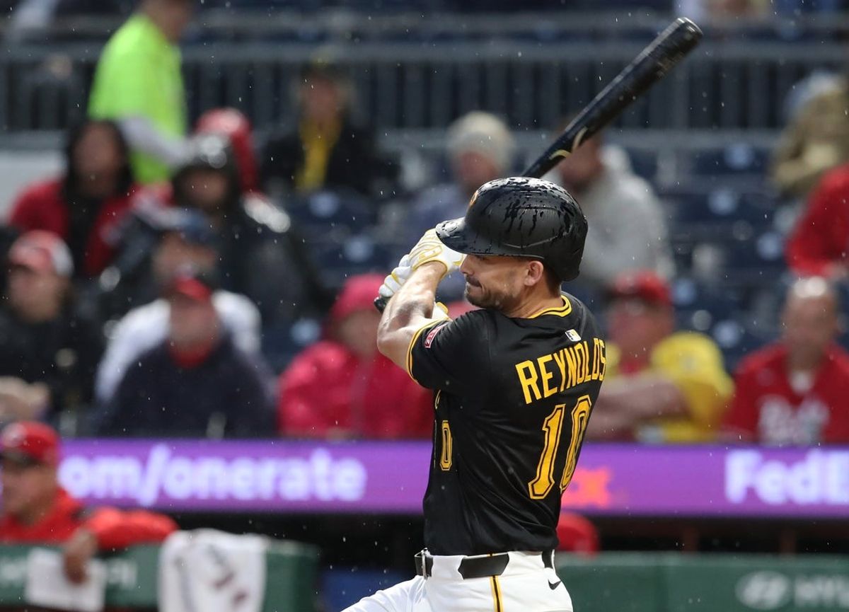 May 20, 2025; Pittsburgh, Pennsylvania, USA; Pittsburgh Pirates right fielder Bryan Reynolds (10) hits an RBI single against the Cincinnati Reds during the sixth inning at PNC Park. Mandatory Credit: Charles LeClaire-Imagn Images