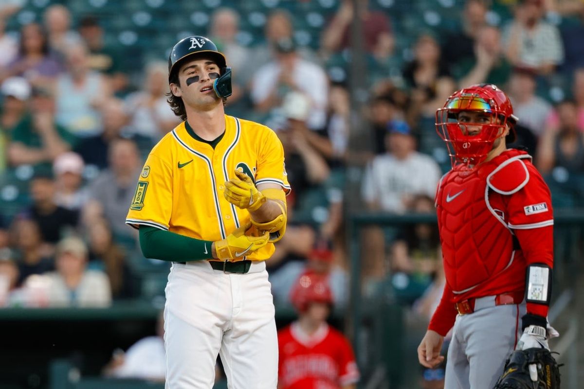 May 20, 2025; West Sacramento, California, USA; Athletics shortstop Jacob Wilson (5) reacts after getting hit by a pitch by Los Angeles Angels pitcher Kyle Hendricks (28) (not pictured) during the third inning at Sutter Health Park. Mandatory Credit: Sergio Estrada-Imagn Images