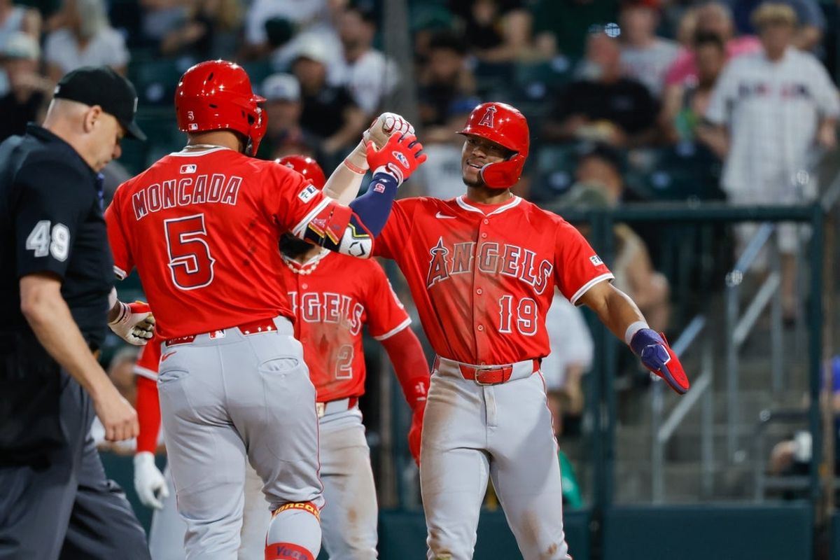May 20, 2025; West Sacramento, California, USA; Los Angeles Angels center fielder Kyren Paris (19) celebrates with third baseman Yoán Moncada (5) after hitting a three run home run during the fifth inning against the Athletics at Sutter Health Park. Mandatory Credit: Sergio Estrada-Imagn Images