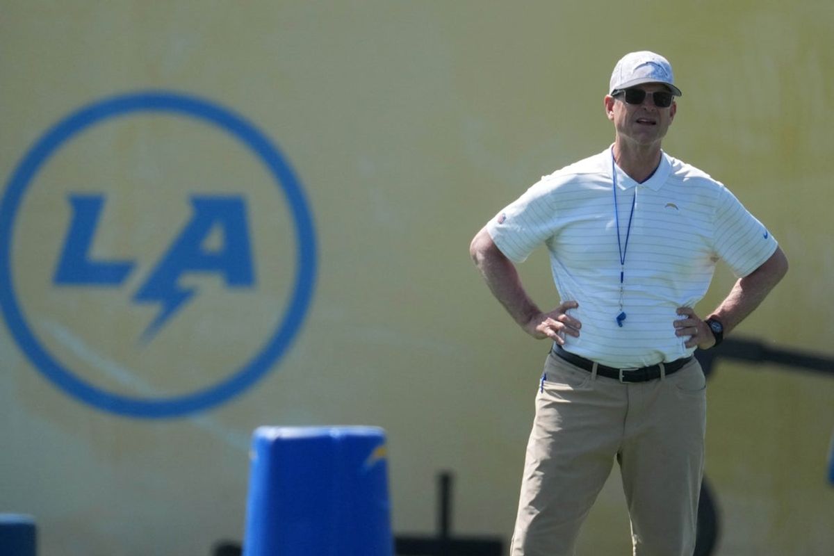 May 20, 2025; El Segundo, CA, USA; Los Angeles Chargers coach Jim Harbaugh looks on during offseason workouts at The Bolt. Mandatory Credit: Kirby Lee-Imagn Images